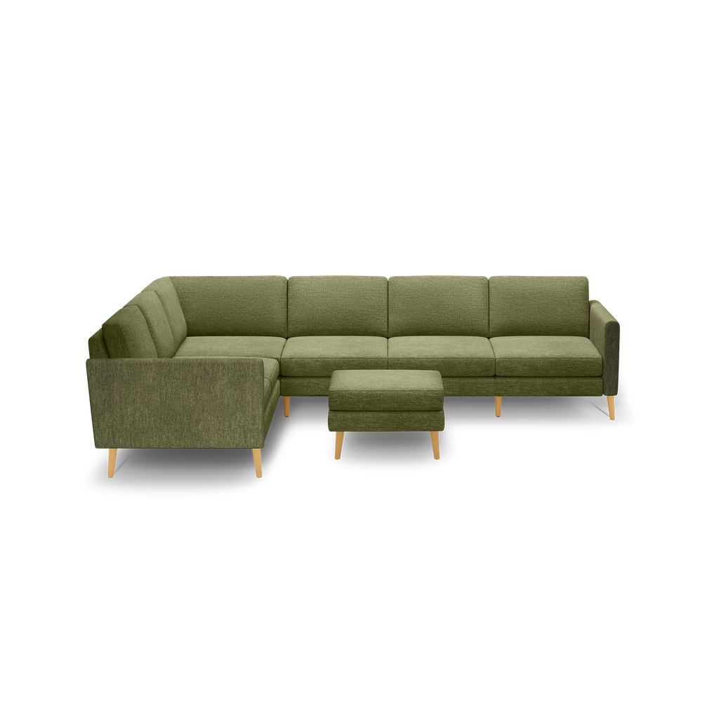 Olive green fabric L-shaped sectional sofa with wooden legs and matching ottoman, modern minimalistic design.
