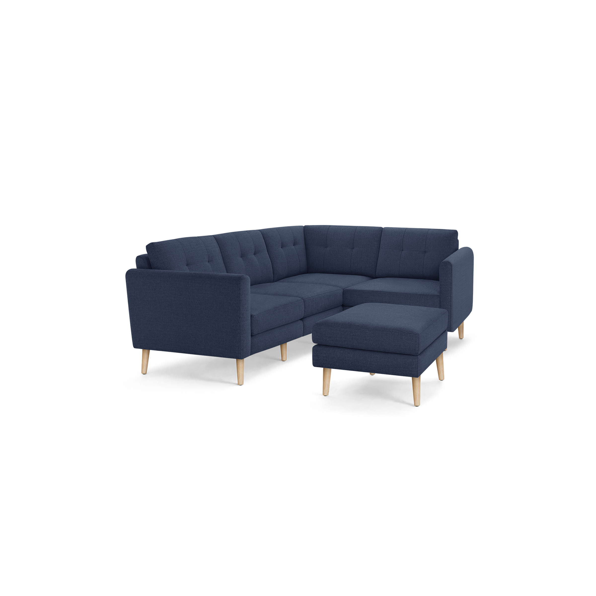 Modern navy blue fabric L-shaped sectional sofa with tufted back cushions and light wooden legs, including a matching ottoman.