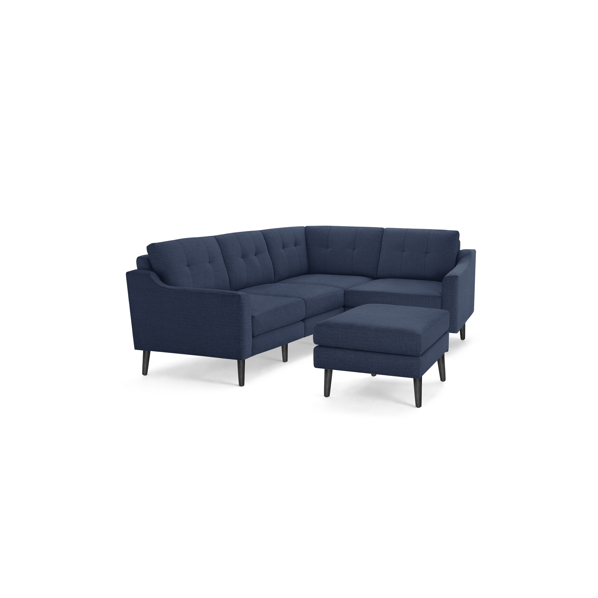 Modern L-shaped navy blue fabric sectional sofa with tufted cushions and matching ottoman on black legs.
