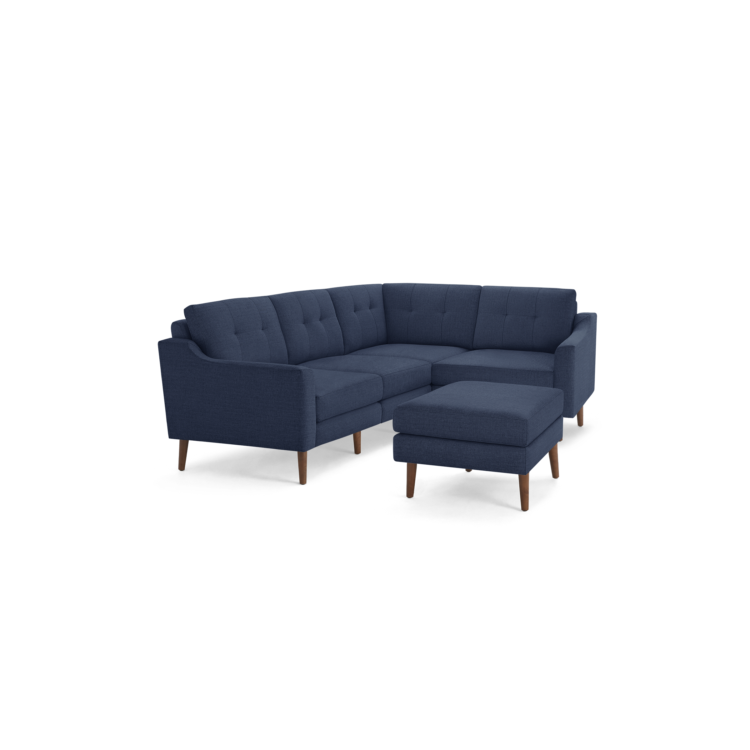 Mid-century modern navy blue fabric L-shaped sectional sofa with tufted cushions and a matching ottoman, supported by wooden legs.
