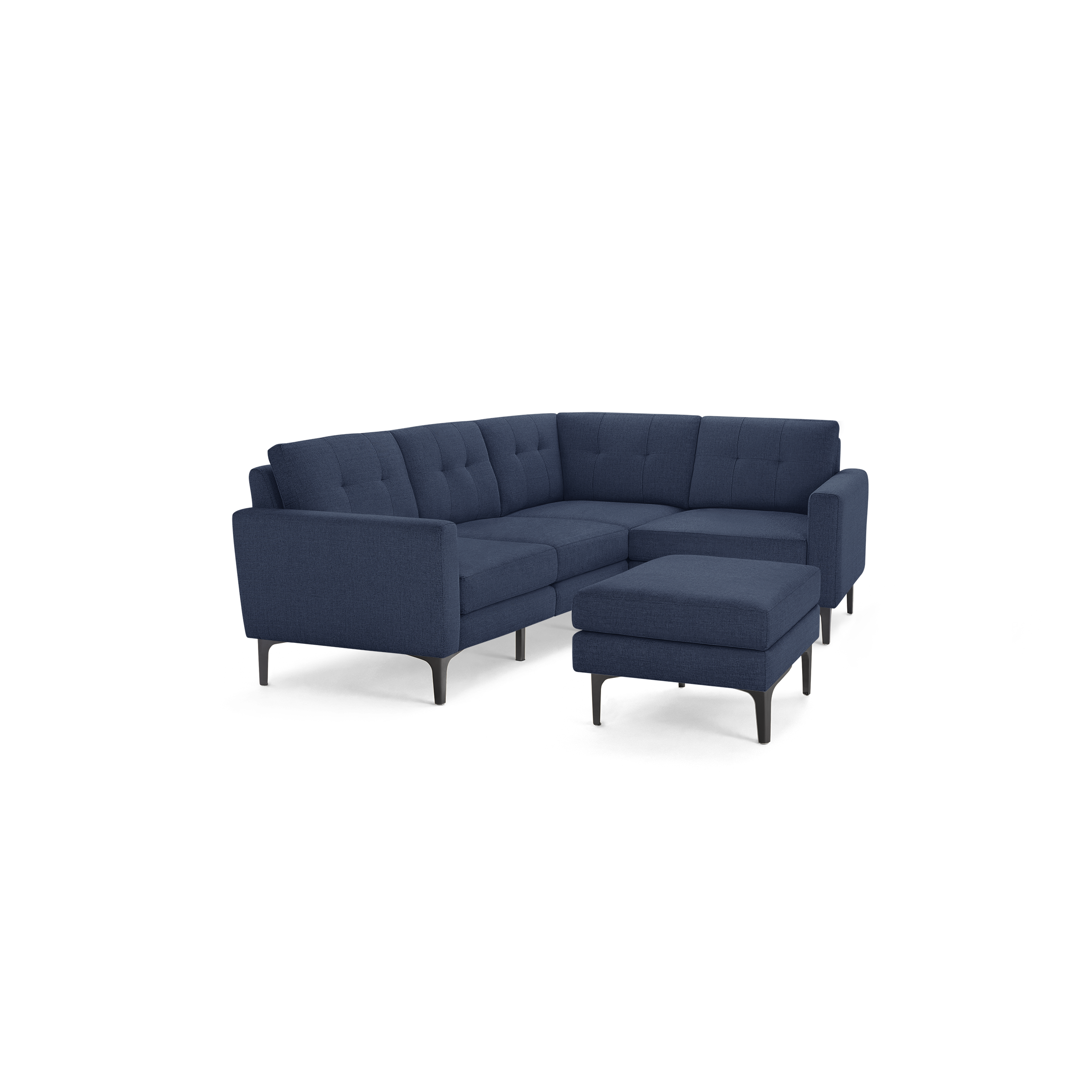 Modern L-shaped sectional sofa in dark blue fabric, featuring tufted cushions and a matching ottoman with slim black legs.