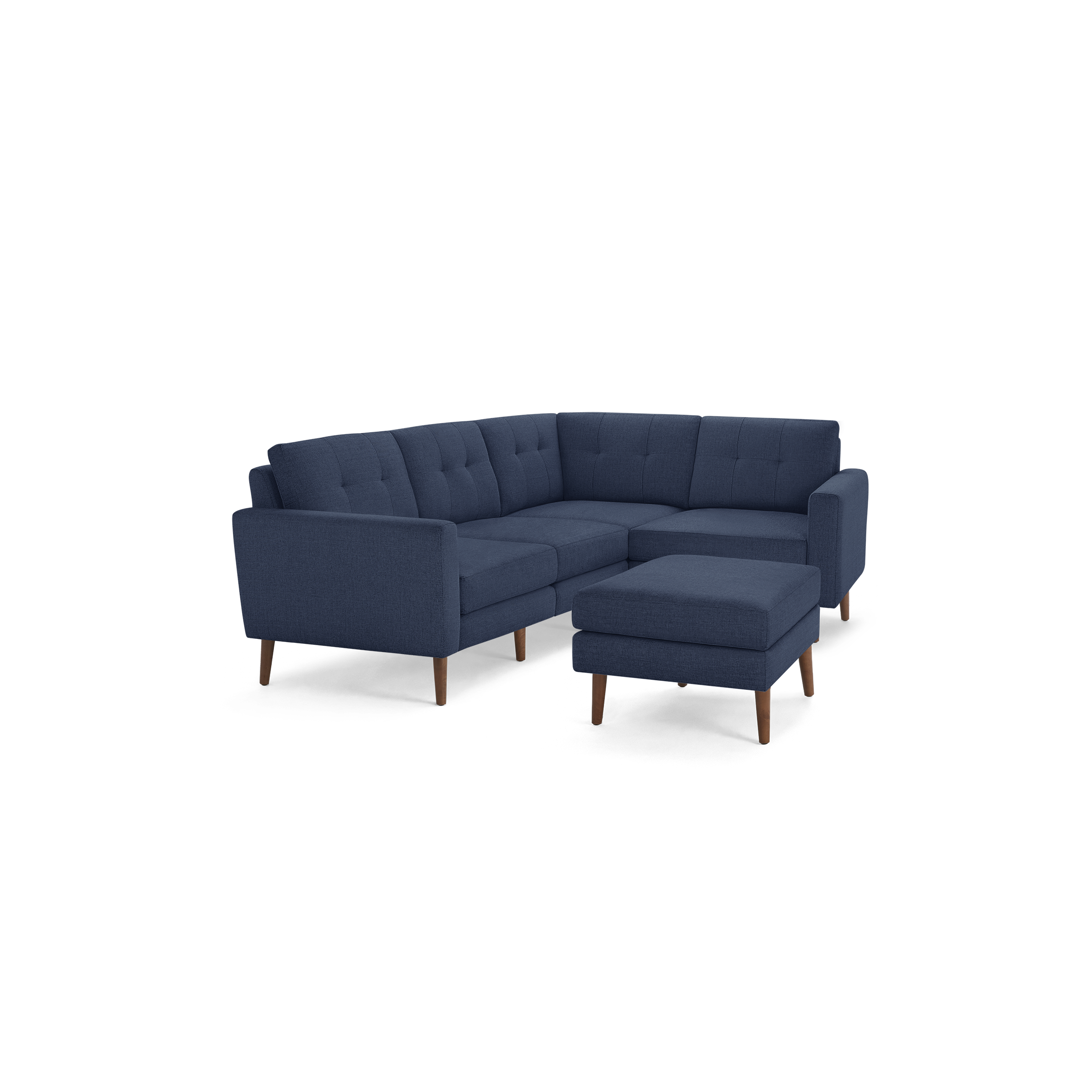 Modern navy blue fabric L-shaped sectional sofa with tufted backrest and matching ottoman, supported by wooden legs.