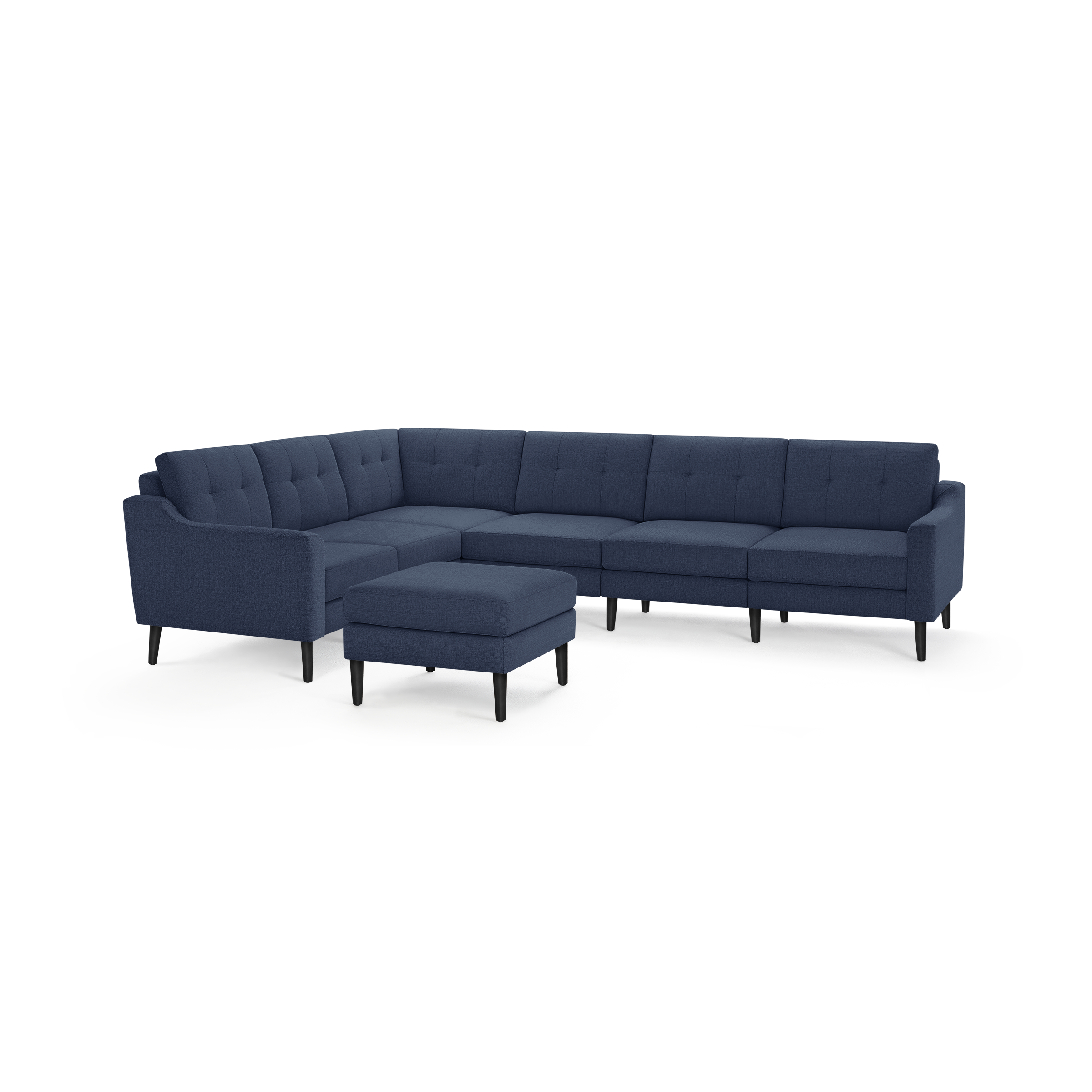 Modern navy blue sectional sofa with tufted cushions, angled arms, black tapered legs, and matching ottoman.
