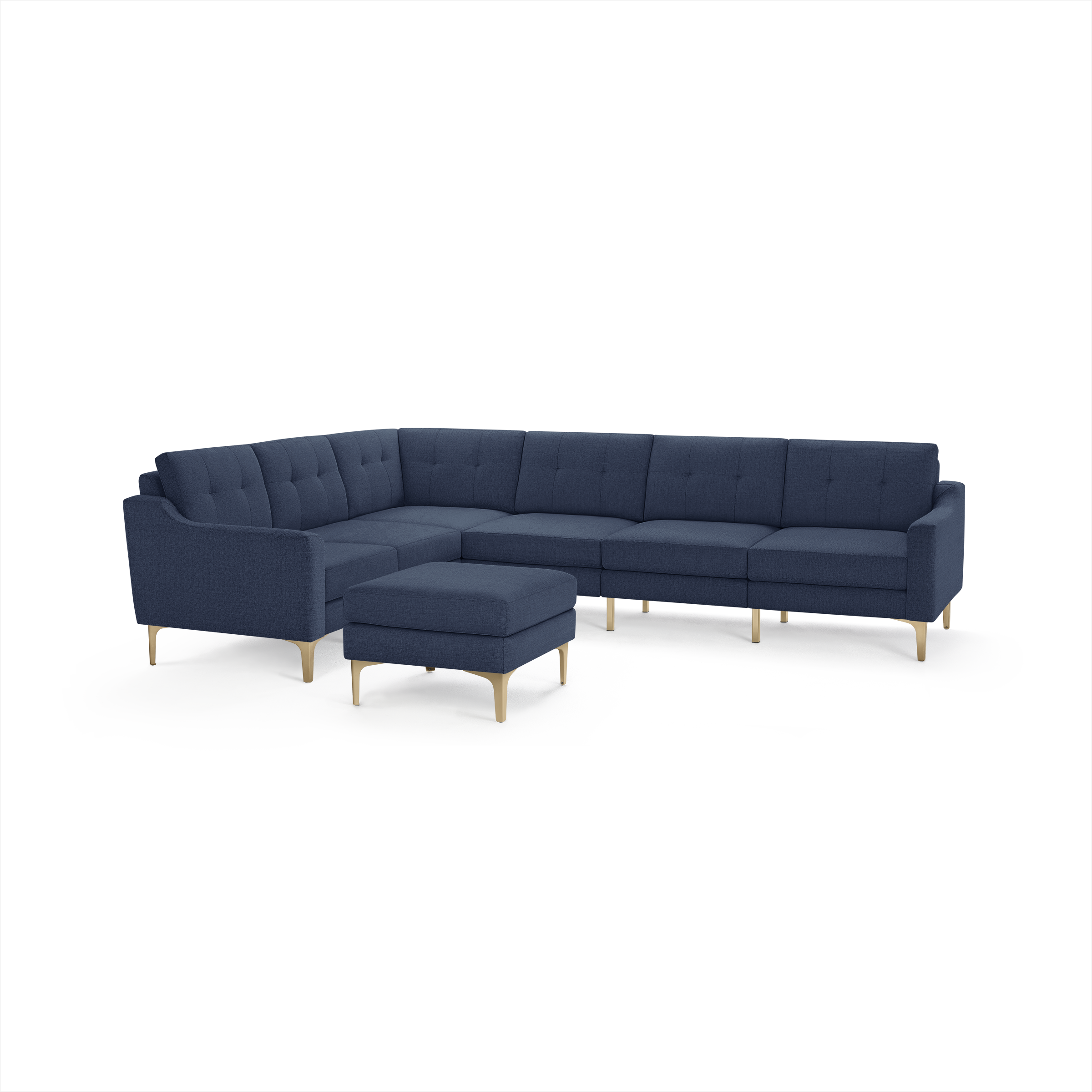 Modern navy blue fabric sectional sofa with tufted cushions and light wooden legs, accompanied by a matching square ottoman.