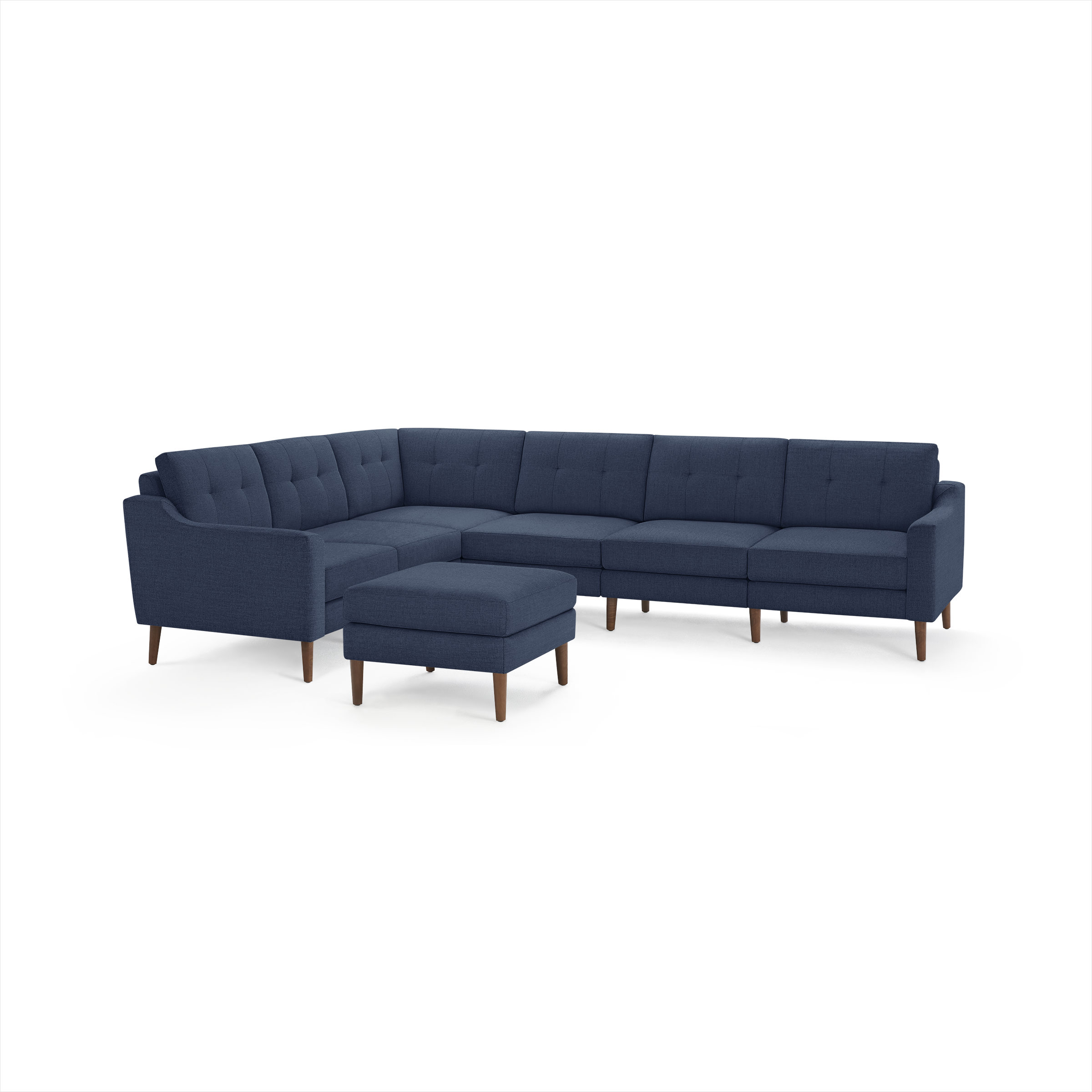 Mid-century modern navy blue fabric sectional sofa with tufted back cushions and wooden legs, including a matching ottoman.