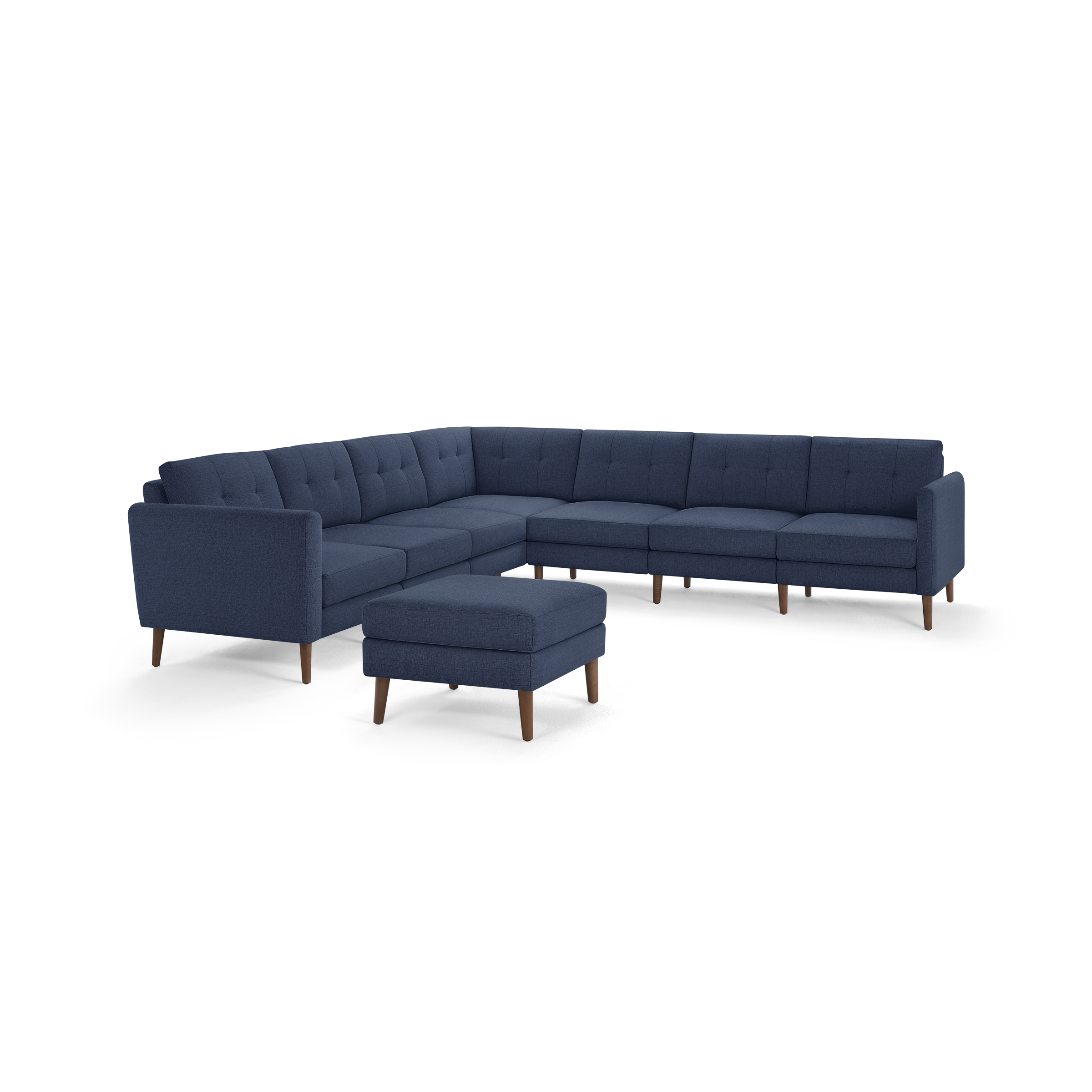 Modern navy blue L-shaped sectional sofa with mid-century wooden legs and matching ottoman.