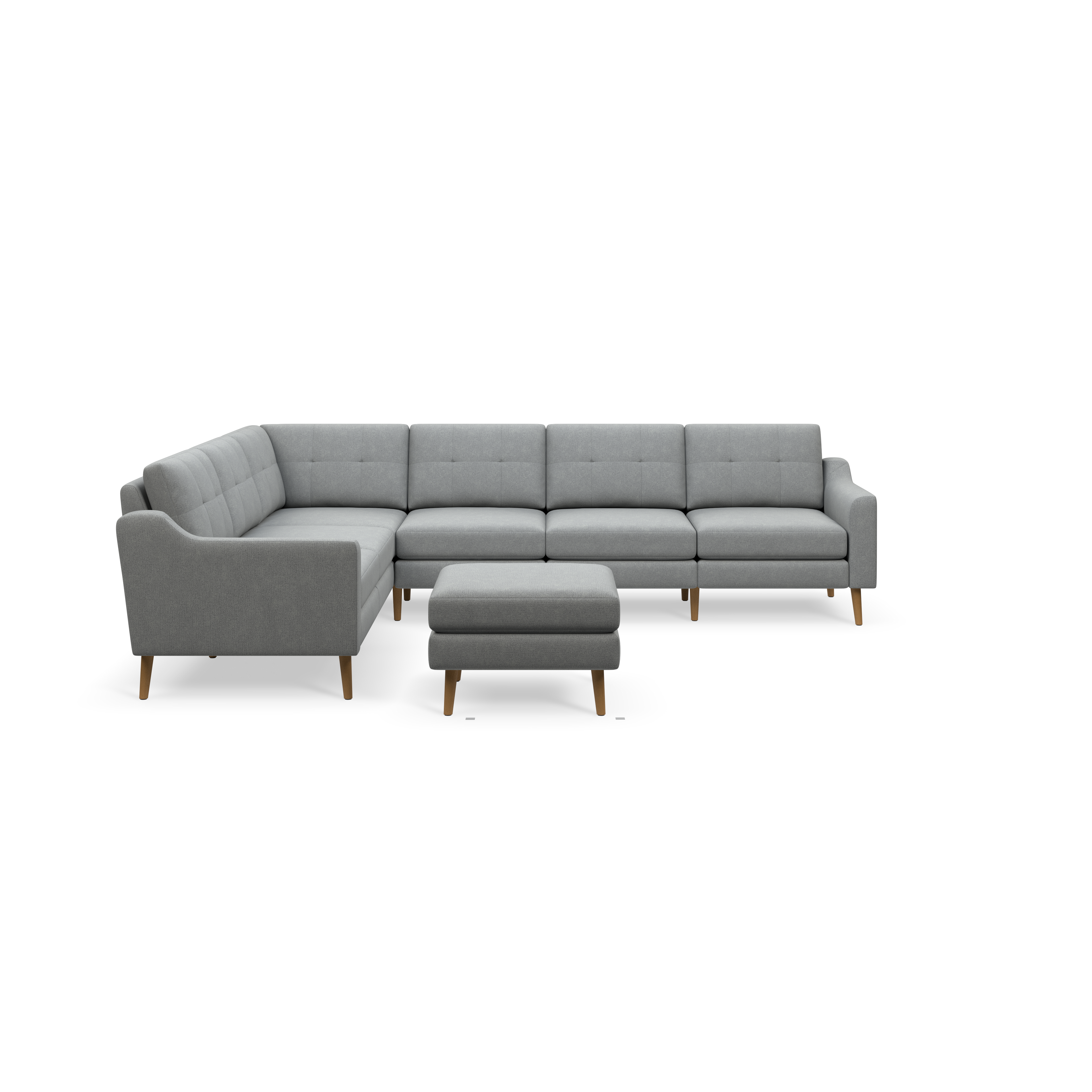 Gray fabric upholstered modern sectional sofa with tufted cushions and wooden legs, accompanied by a matching ottoman.