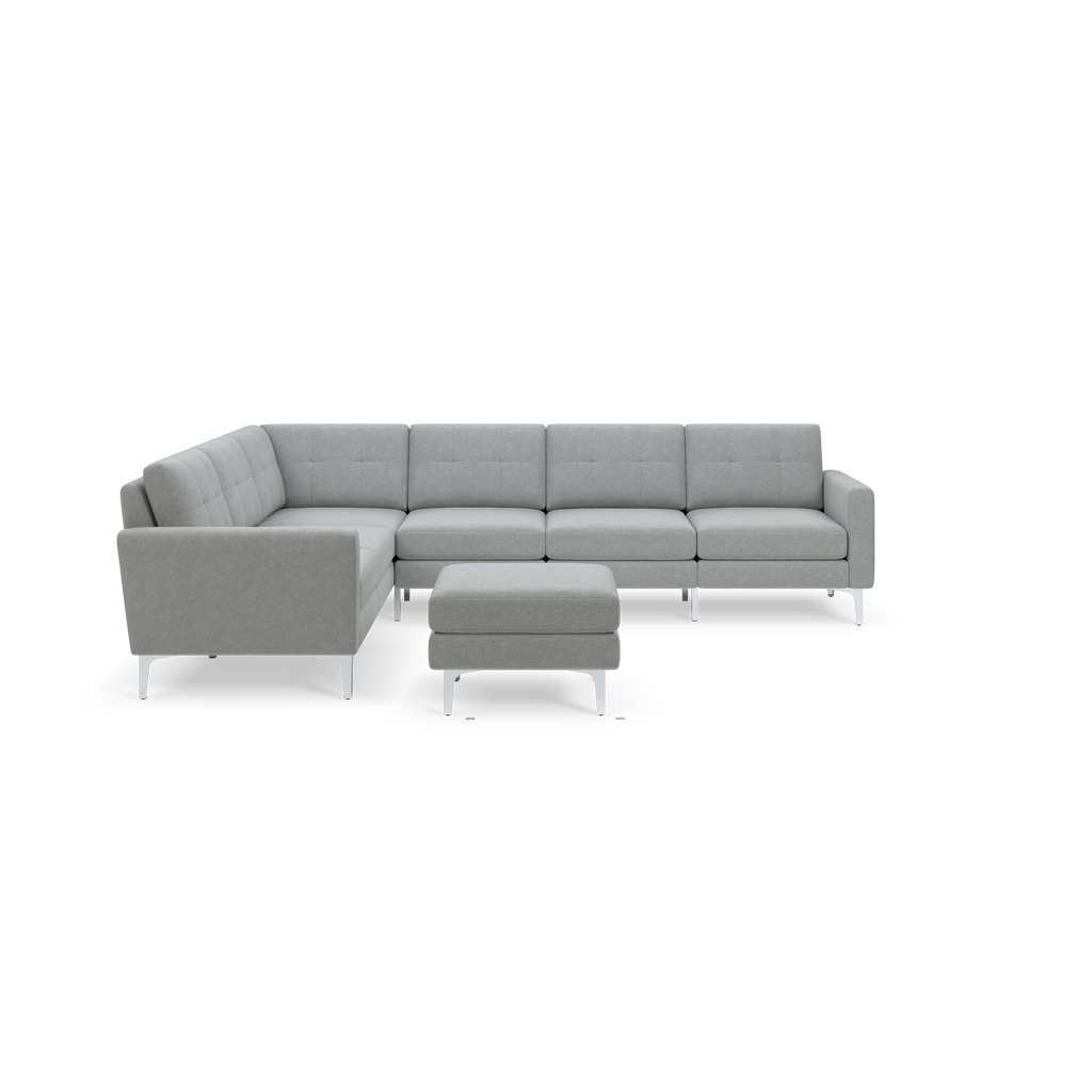 Light gray modern sectional sofa with tufted cushions and matching ottoman, supported by sleek metal legs.