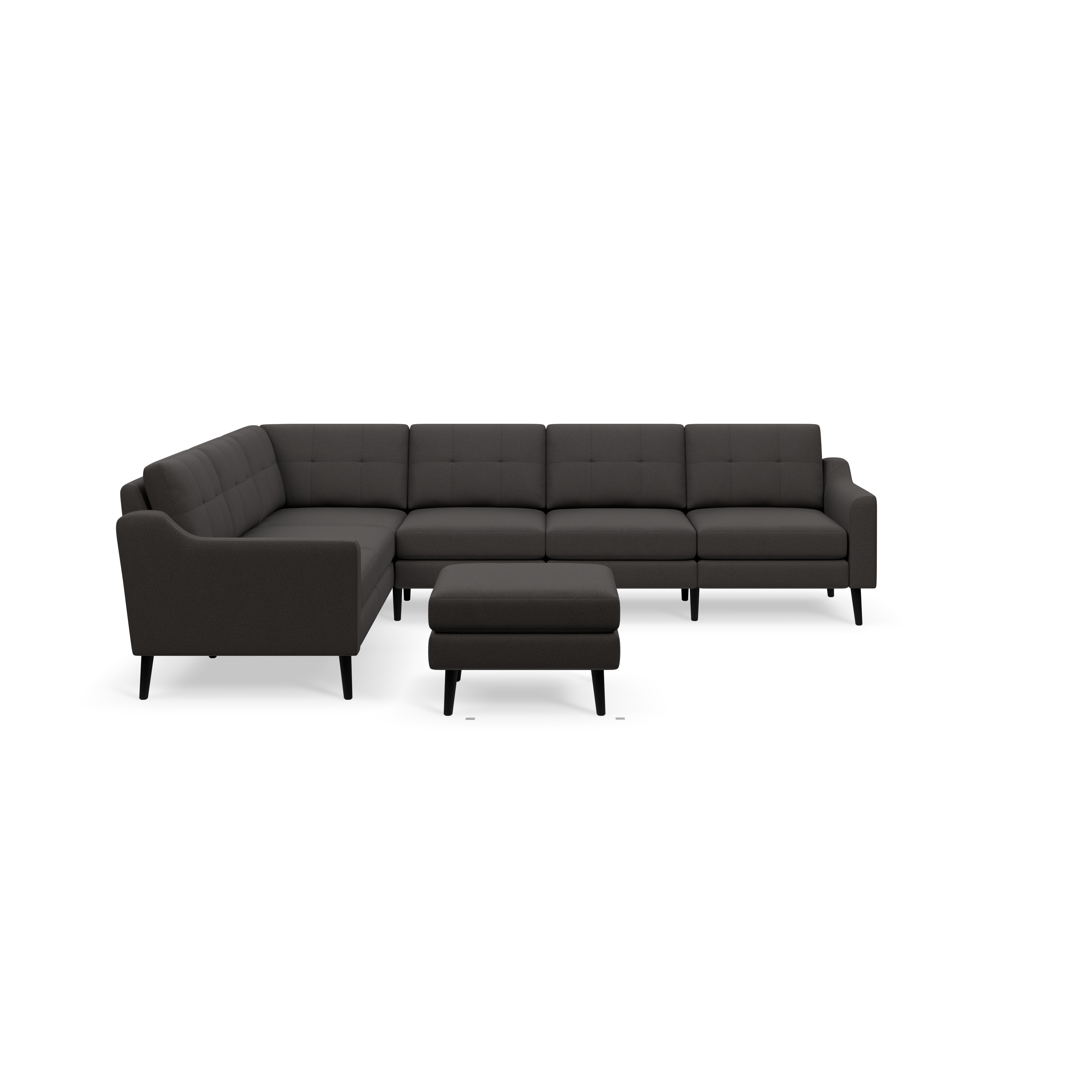 Dark gray L-shaped sectional sofa with tufted cushions and matching ottoman, supported by black wooden legs.