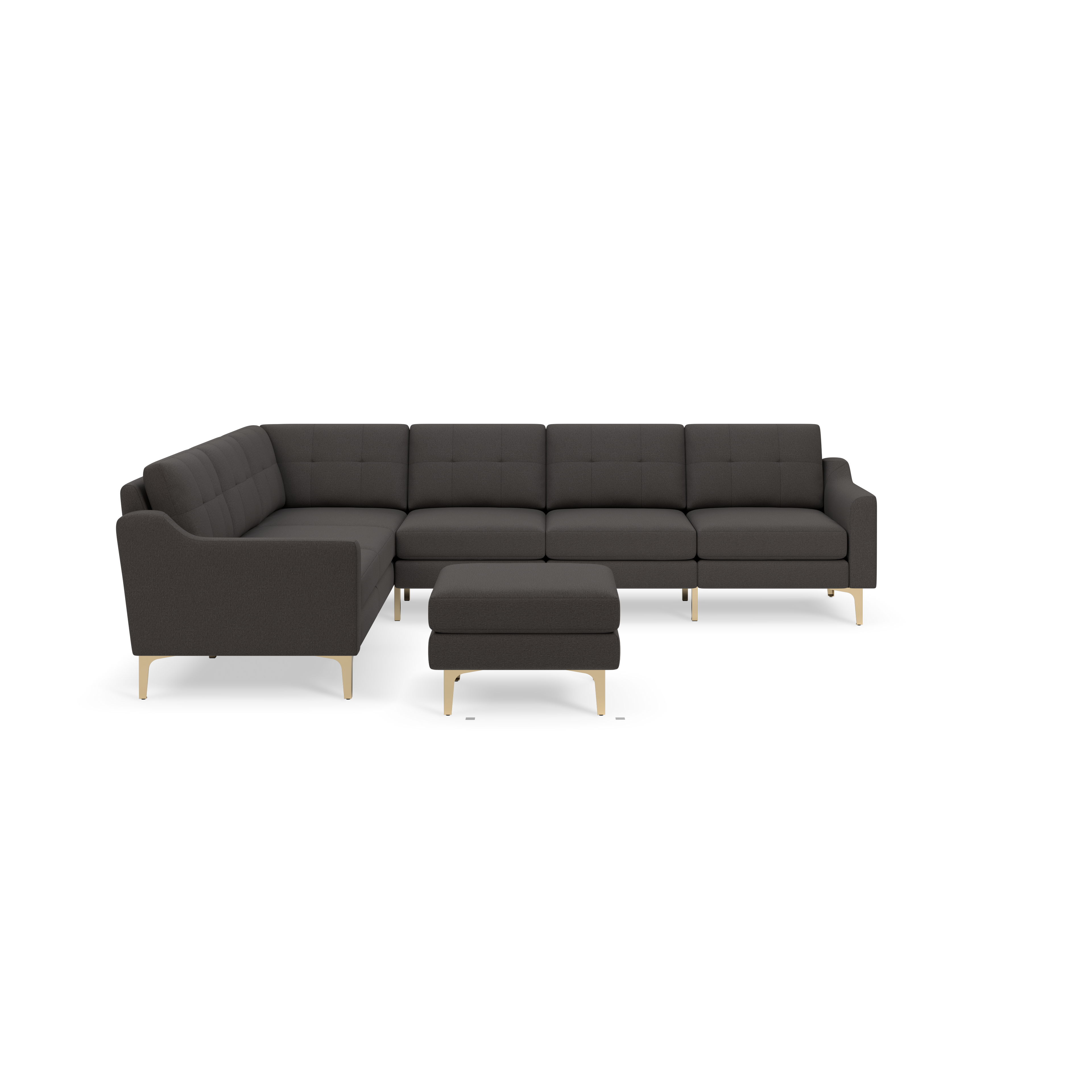 Dark gray L-shaped sectional sofa with tufted cushions and matching ottoman, both featuring slim gold legs, shown on black background.