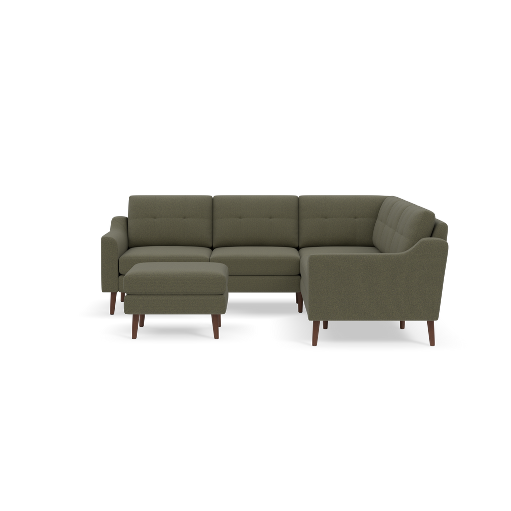 L-shaped sectional sofa in Moss green fabric with tufted cushions and wooden legs, accompanied by a matching ottoman.