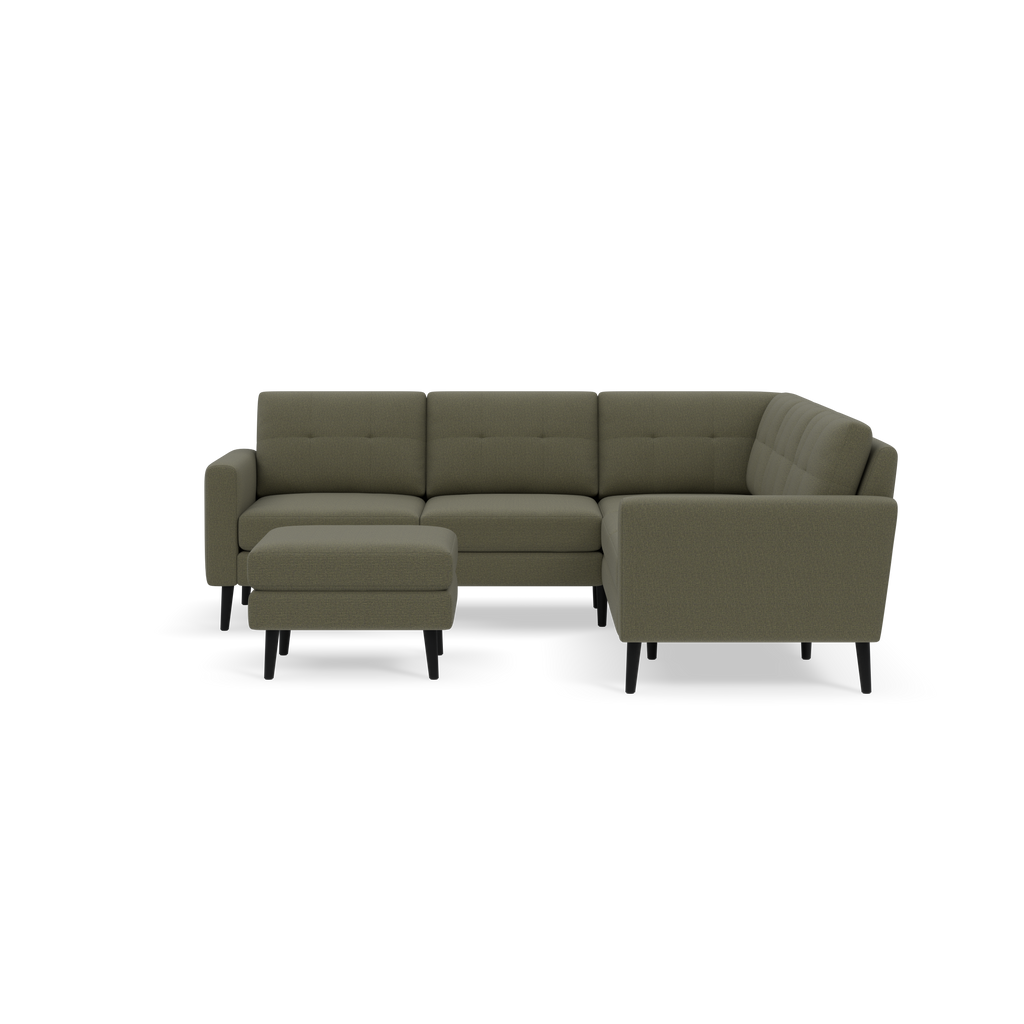 Modern olive green fabric L-shaped sectional sofa with tufted cushions and matching ottoman on black wooden legs.