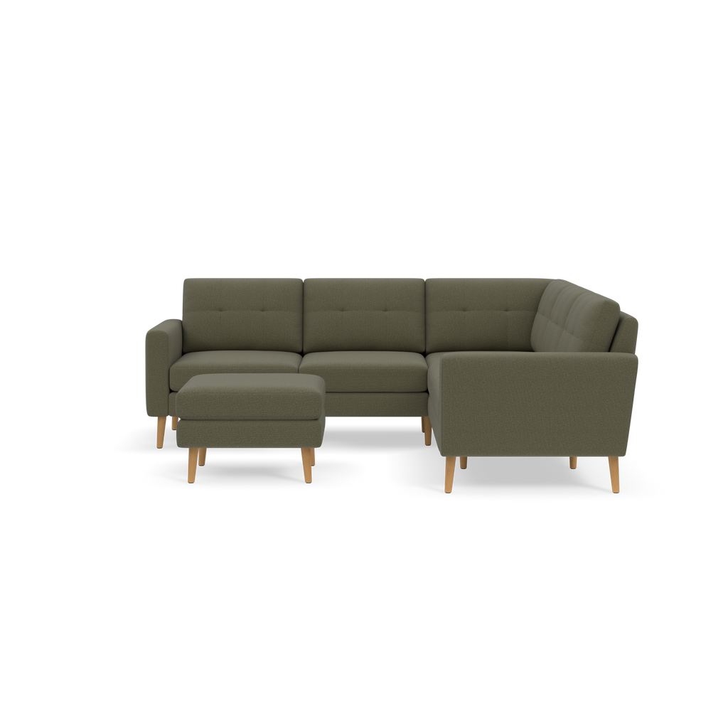 Modern olive green L-shaped sectional sofa with tufted cushions and light wooden legs, paired with a matching ottoman.
