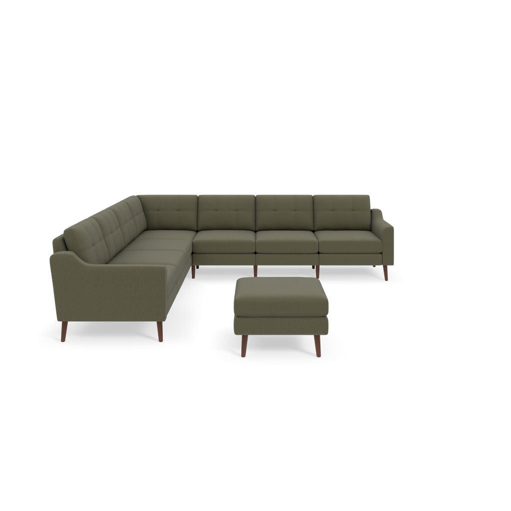 Moss green sectional sofa with tufted cushions, angled armrests, wooden legs, and matching square ottoman against black background.