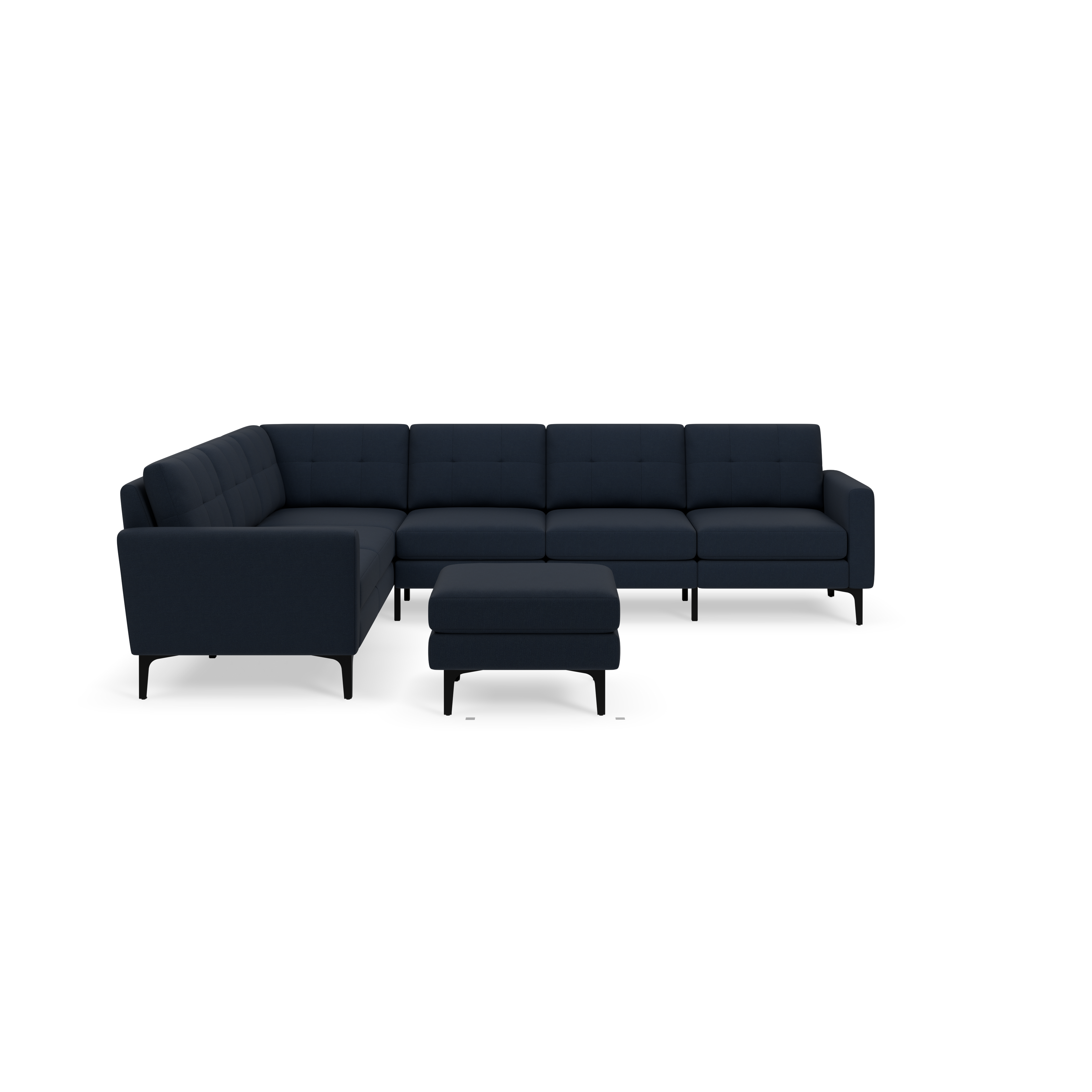 Dark blue L-shaped sectional sofa with button-tufted cushions and a matching ottoman, supported by slim black legs.