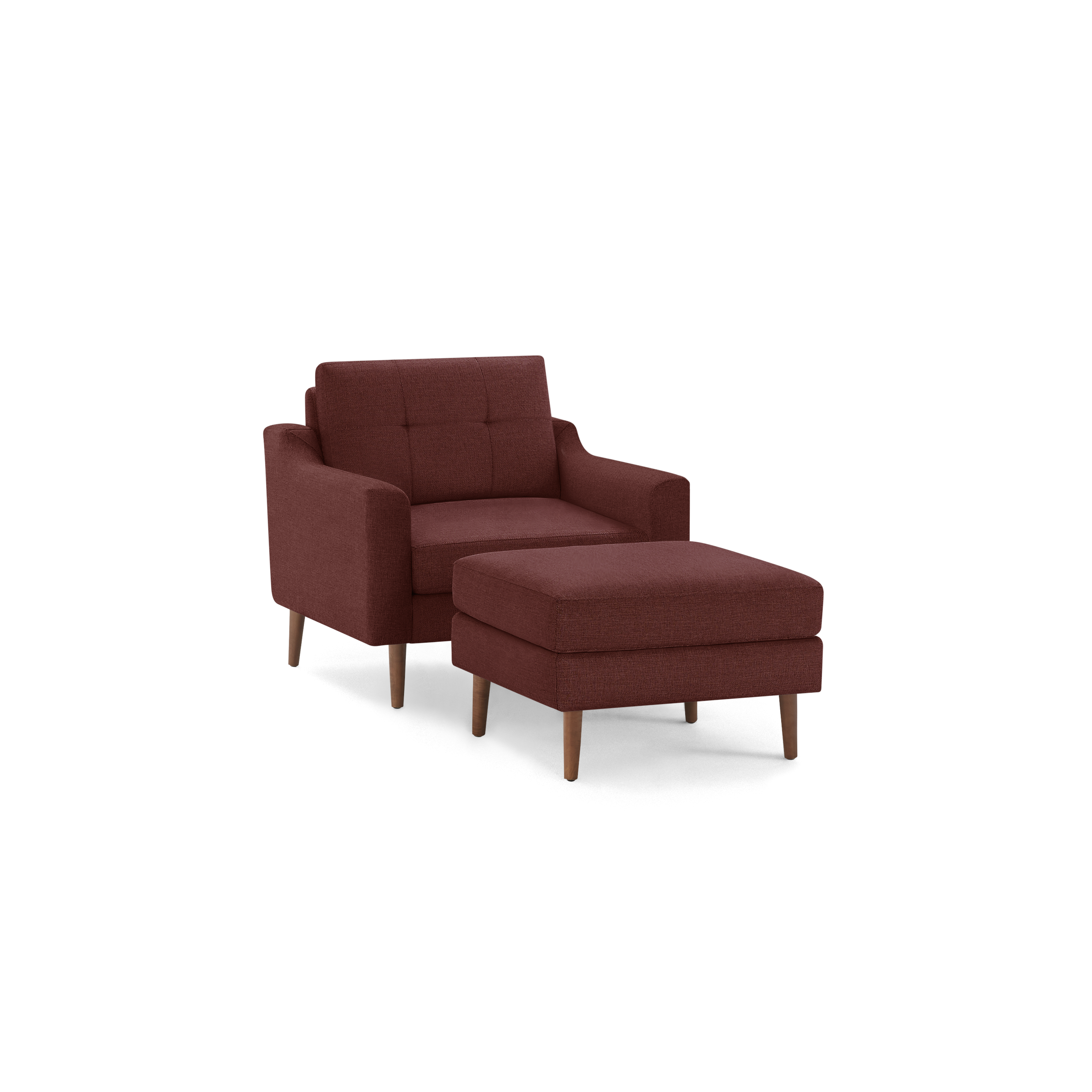 Mid-century style burgundy armchair with matching cushioned ottoman, both featuring wooden legs and tufted upholstery.