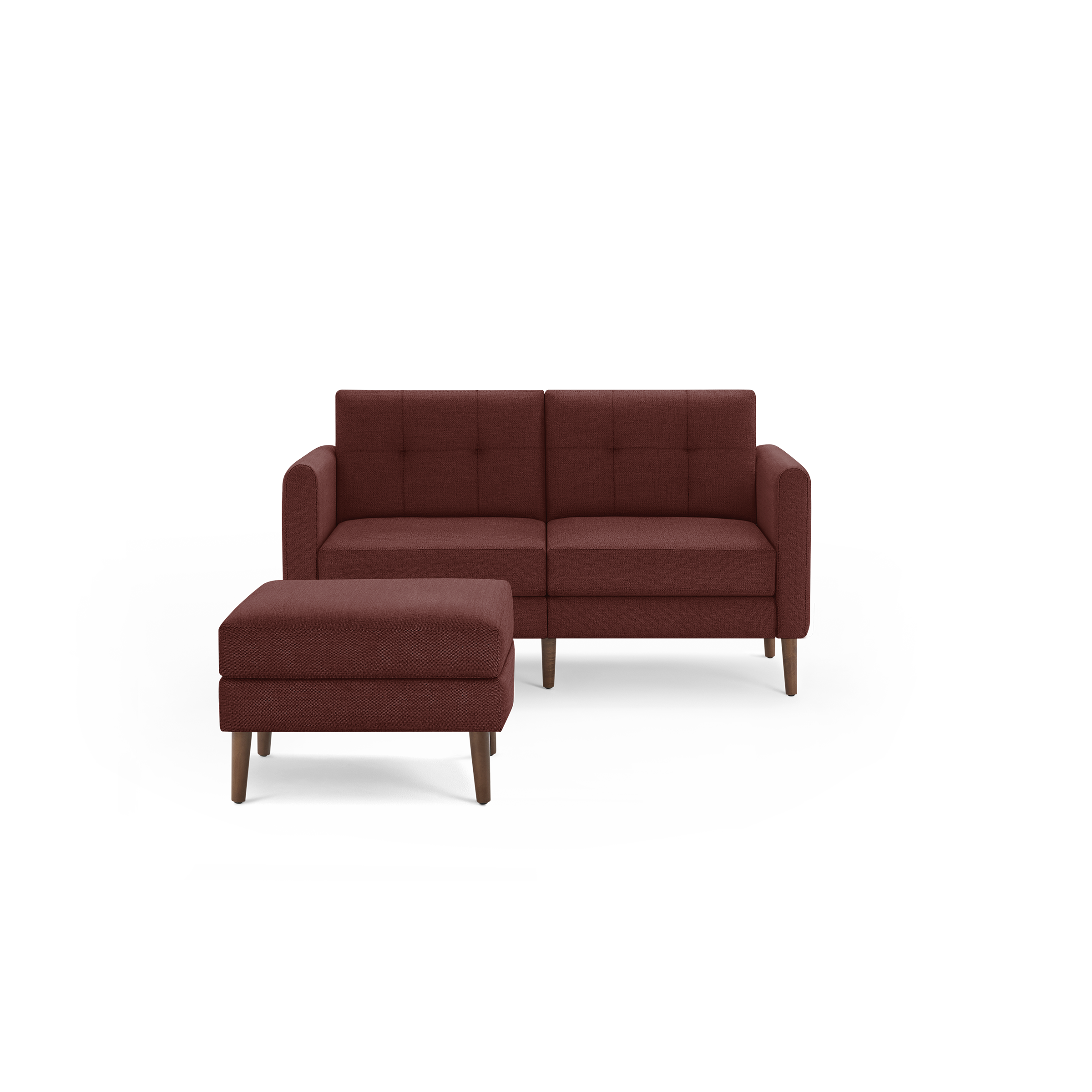 Mid-century style small red fabric loveseat with matching ottoman, featuring tufted cushions and wooden legs.