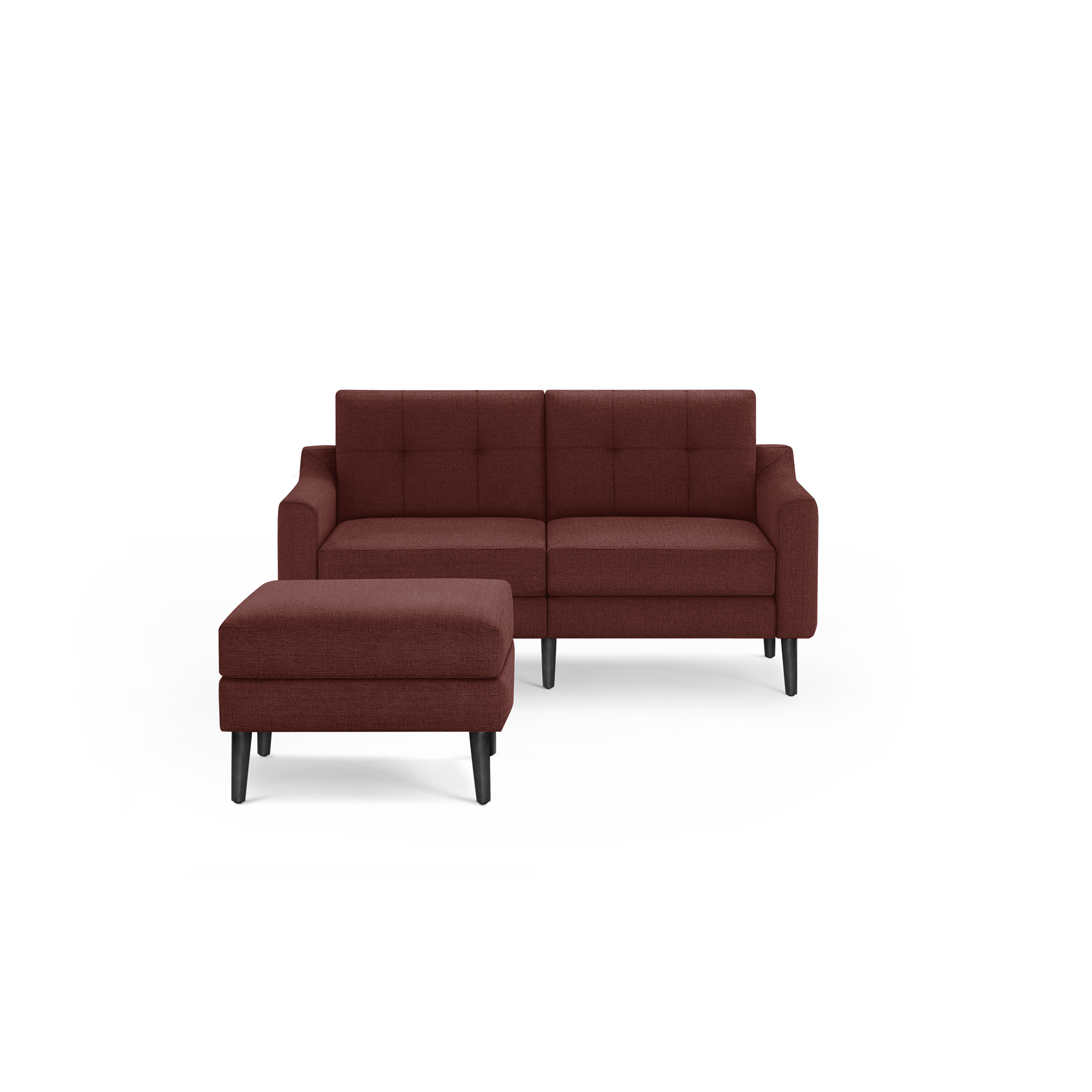 Modern two-seater sofa and matching ottoman in dark red upholstery with tufted back and black tapered legs.