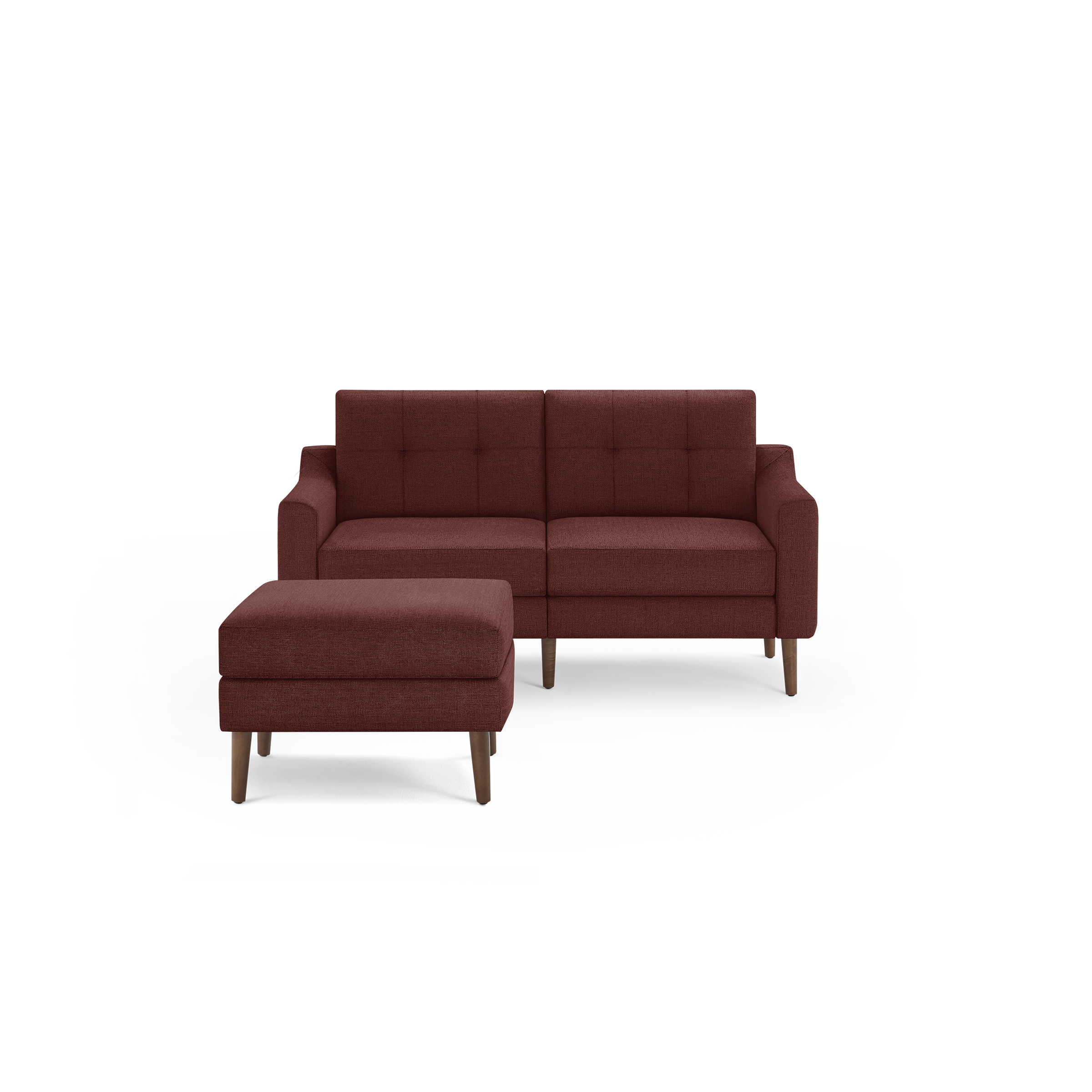 Mid-century modern deep red fabric loveseat sofa with button tufted backrest and matching ottoman on wooden legs.