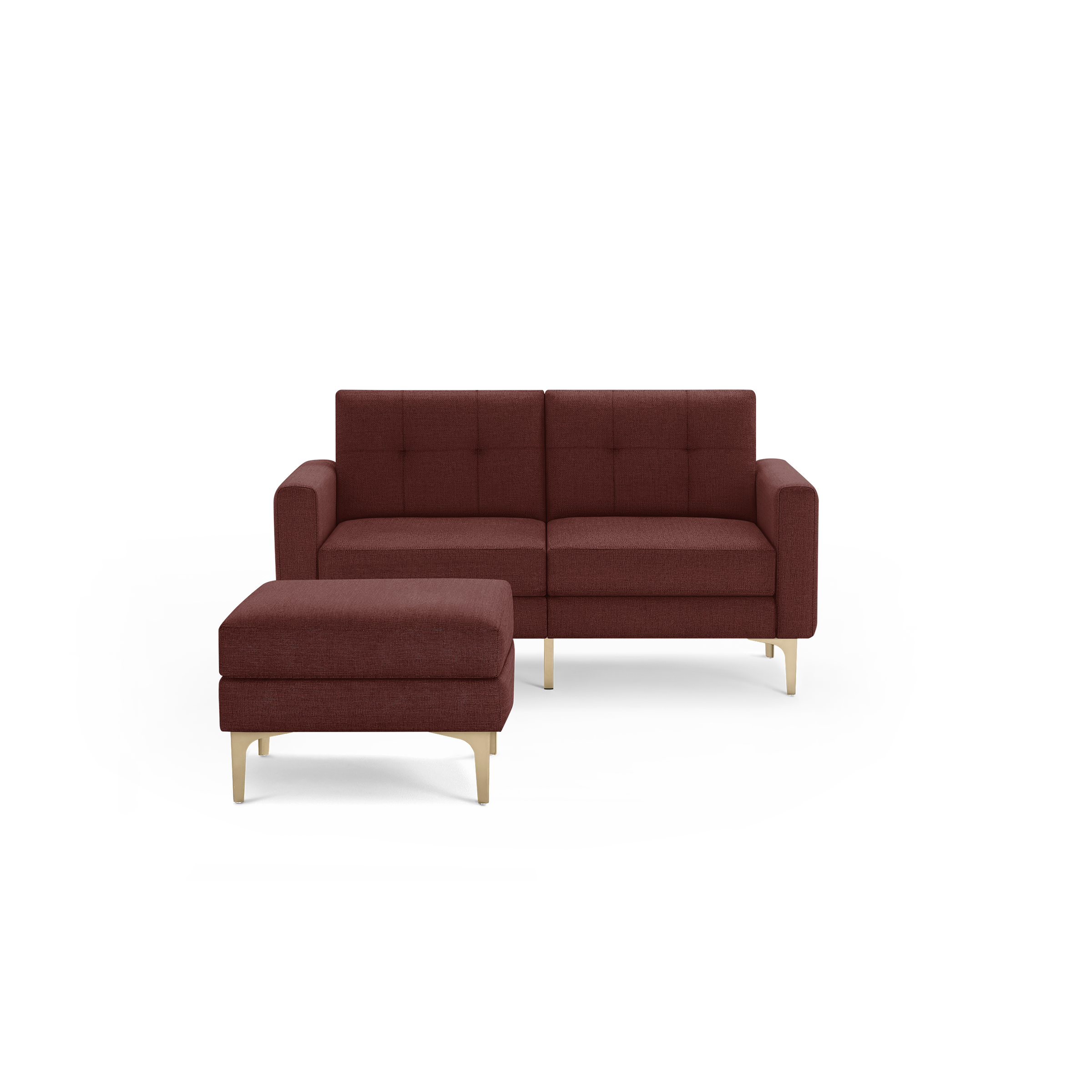 Modern two-seater sofa and matching ottoman in deep red fabric with tufted cushions and light wooden legs.