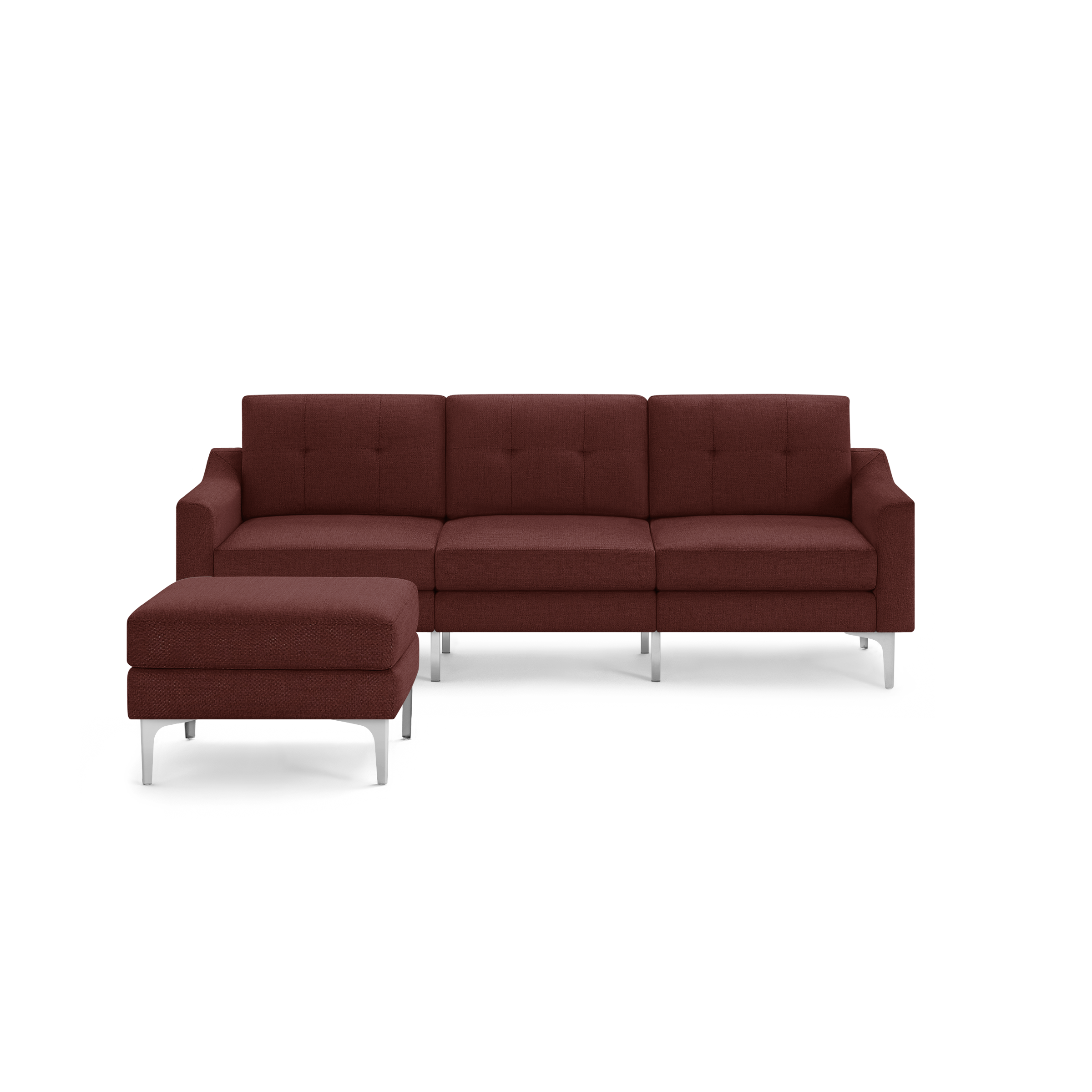 Modern sectional sofa in deep red fabric upholstery with tufted cushions, metal legs, and matching ottoman.