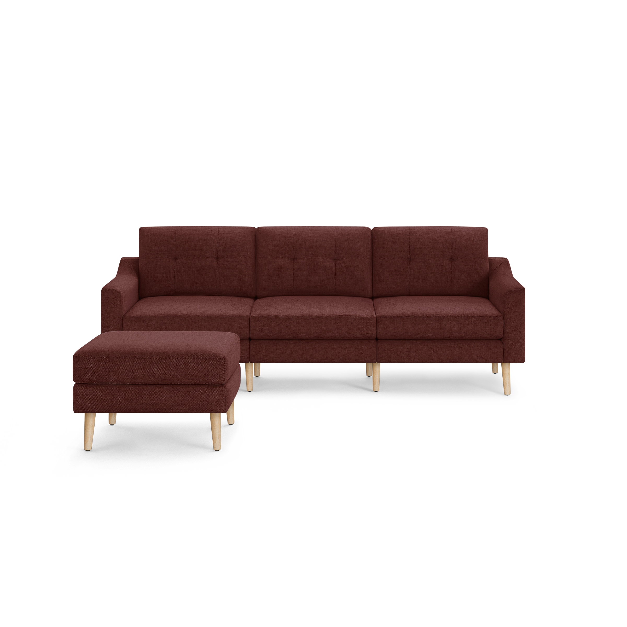 Modern sectional sofa in deep burgundy fabric with tufted backrest, wooden legs, and matching ottoman on left side.