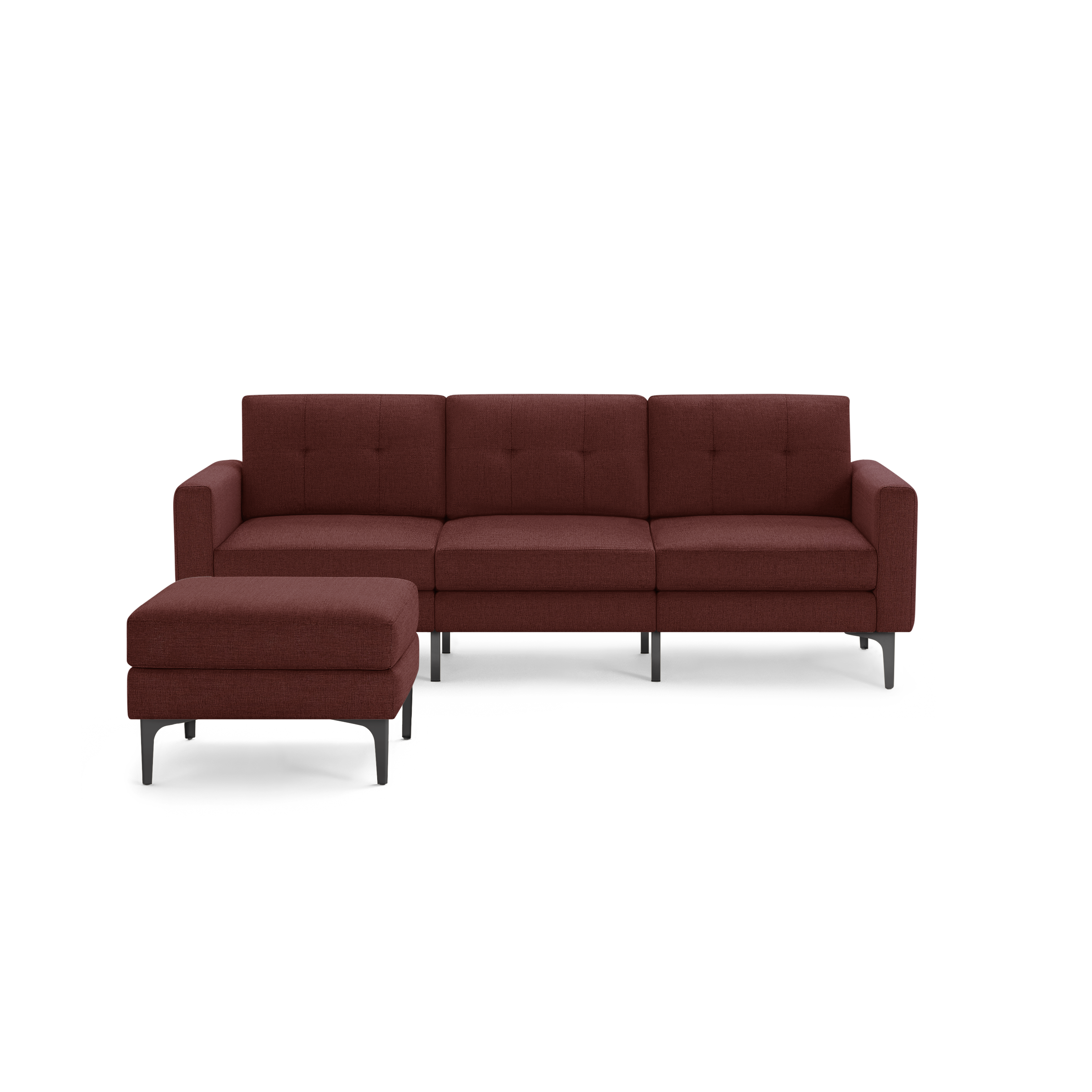 Modern three-seater sectional sofa in dark red upholstery with metal legs and matching ottoman, tufted back cushions.