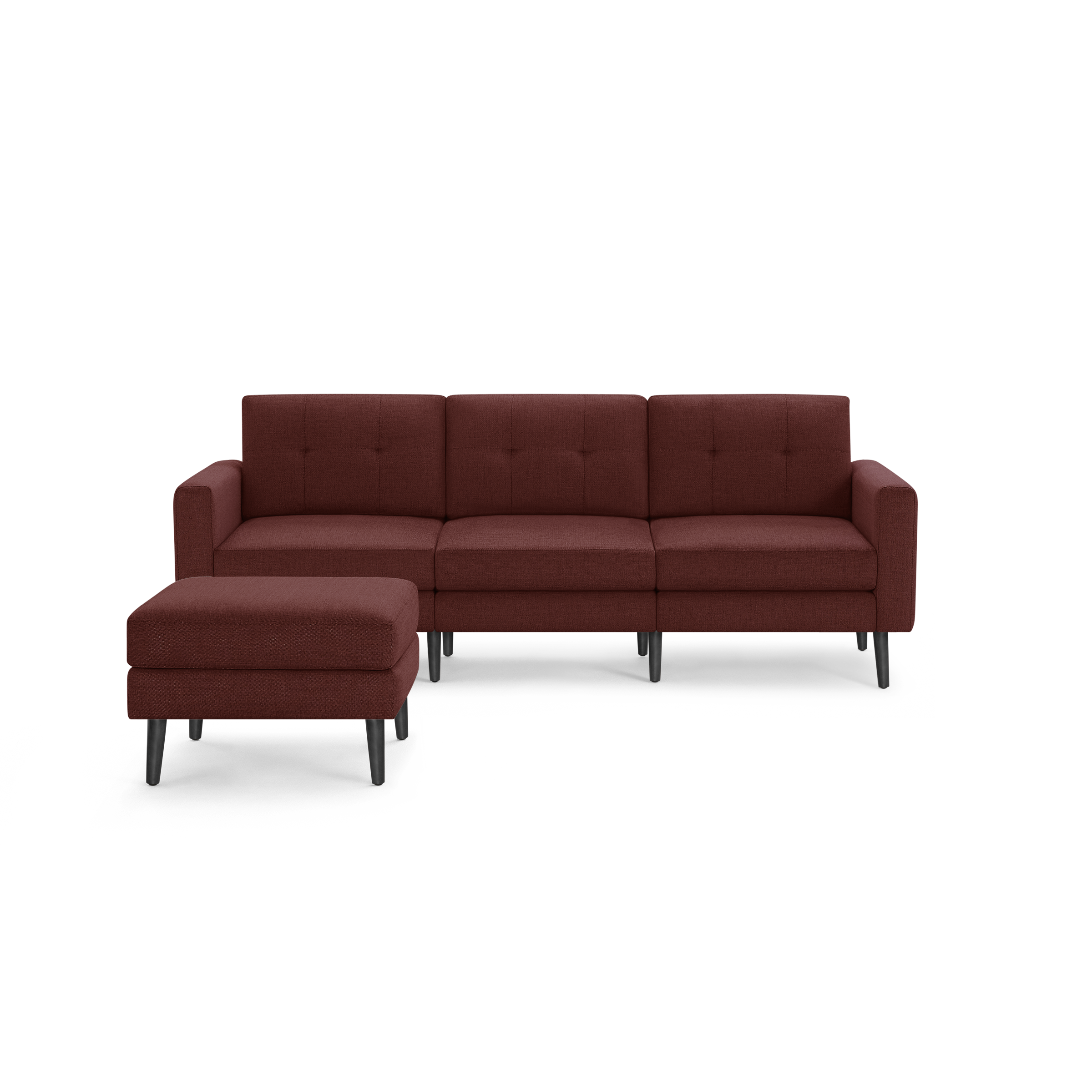 Modern sectional sofa in deep red fabric with button-tufted cushions and angled black wooden legs, featuring a matching ottoman.