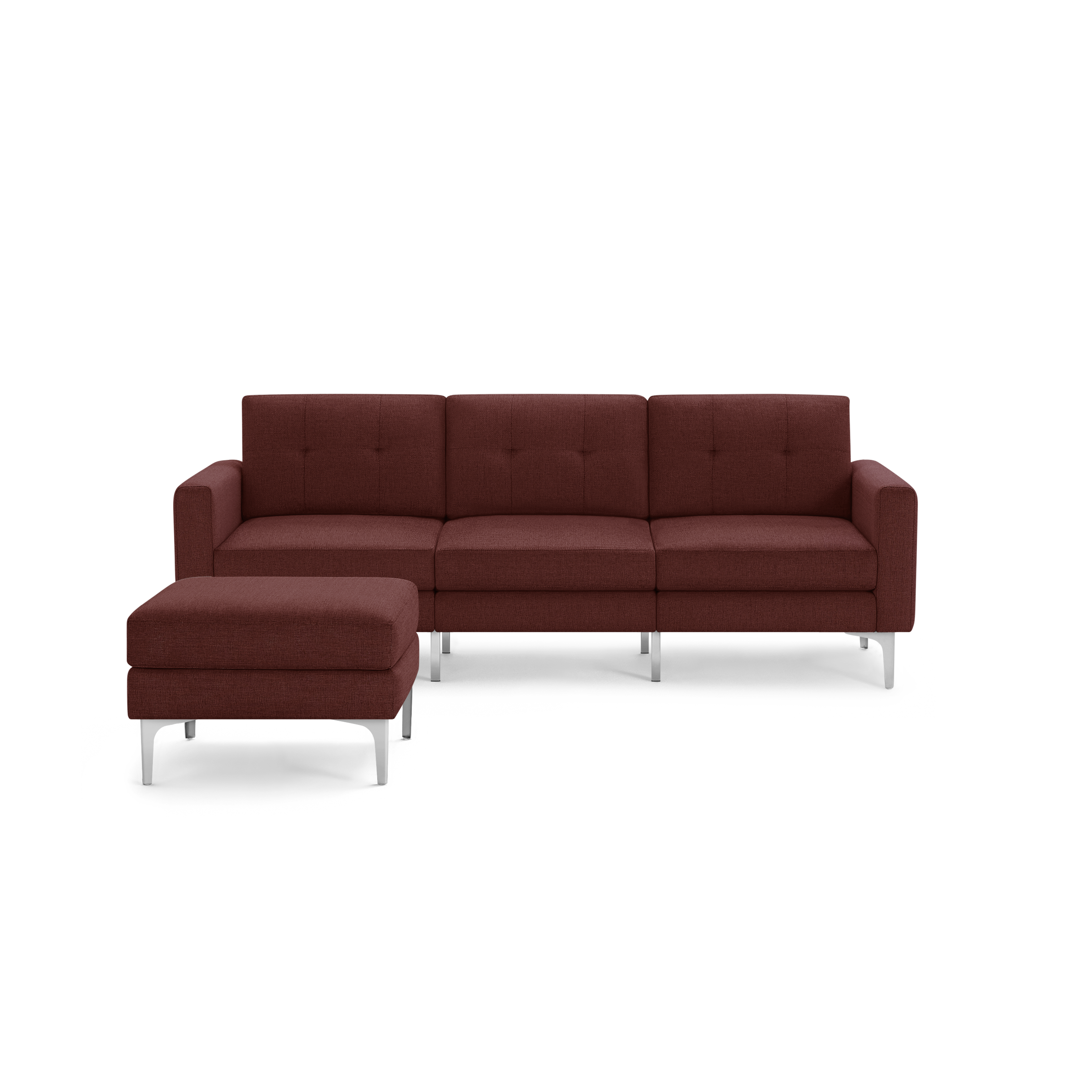 Modern sectional sofa in deep red fabric with tufted back cushions and sleek silver metal legs, featuring a matching ottoman.