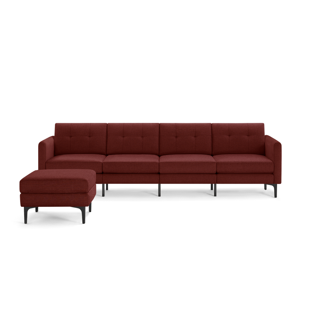 Modern deep red sectional sofa with tufted cushions, black metal legs, and matching ottoman on the left side.