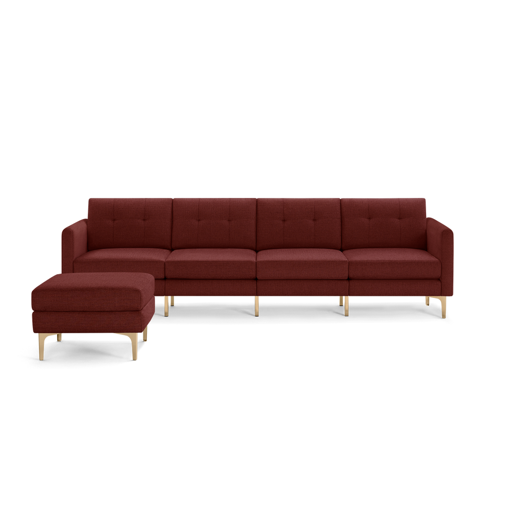 Modern sectional sofa with four seats, upholstered in deep red fabric, featuring tufted cushions and gold metal legs, with matching ottoman.