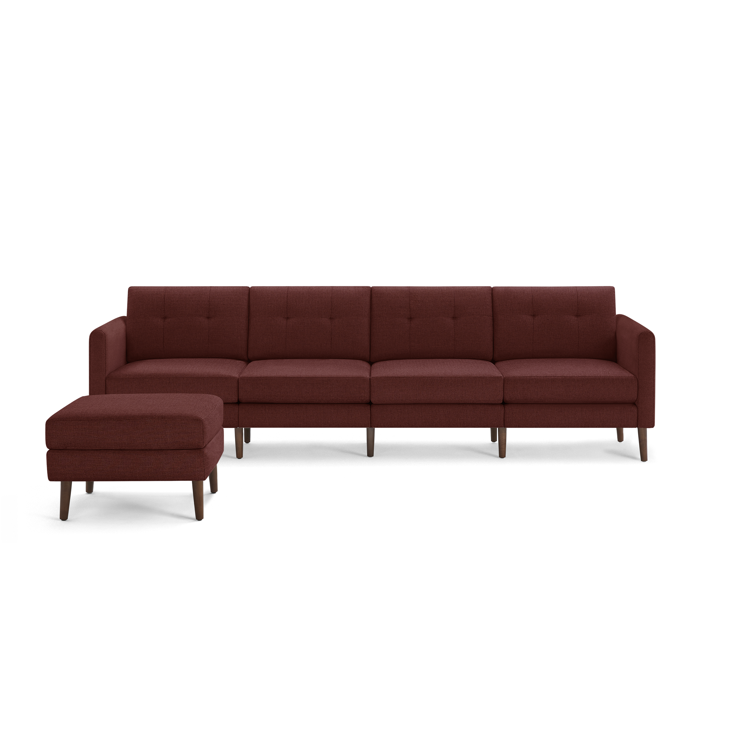 Mid-century modern sectional sofa in rich brick red fabric with tufted back cushions and matching ottoman, supported by wooden legs.