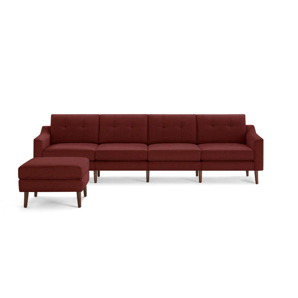 Modern burnt orange fabric sectional sofa with tufted cushions, wooden legs, and a matching ottoman on the left side.