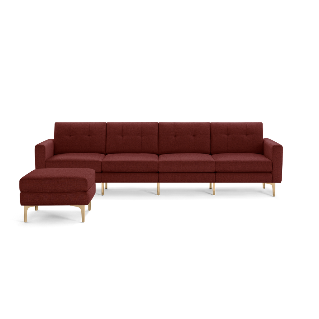 Modern sectional sofa with maroon upholstery, button-tufted back cushions, gold metal legs, and matching ottoman on left side.