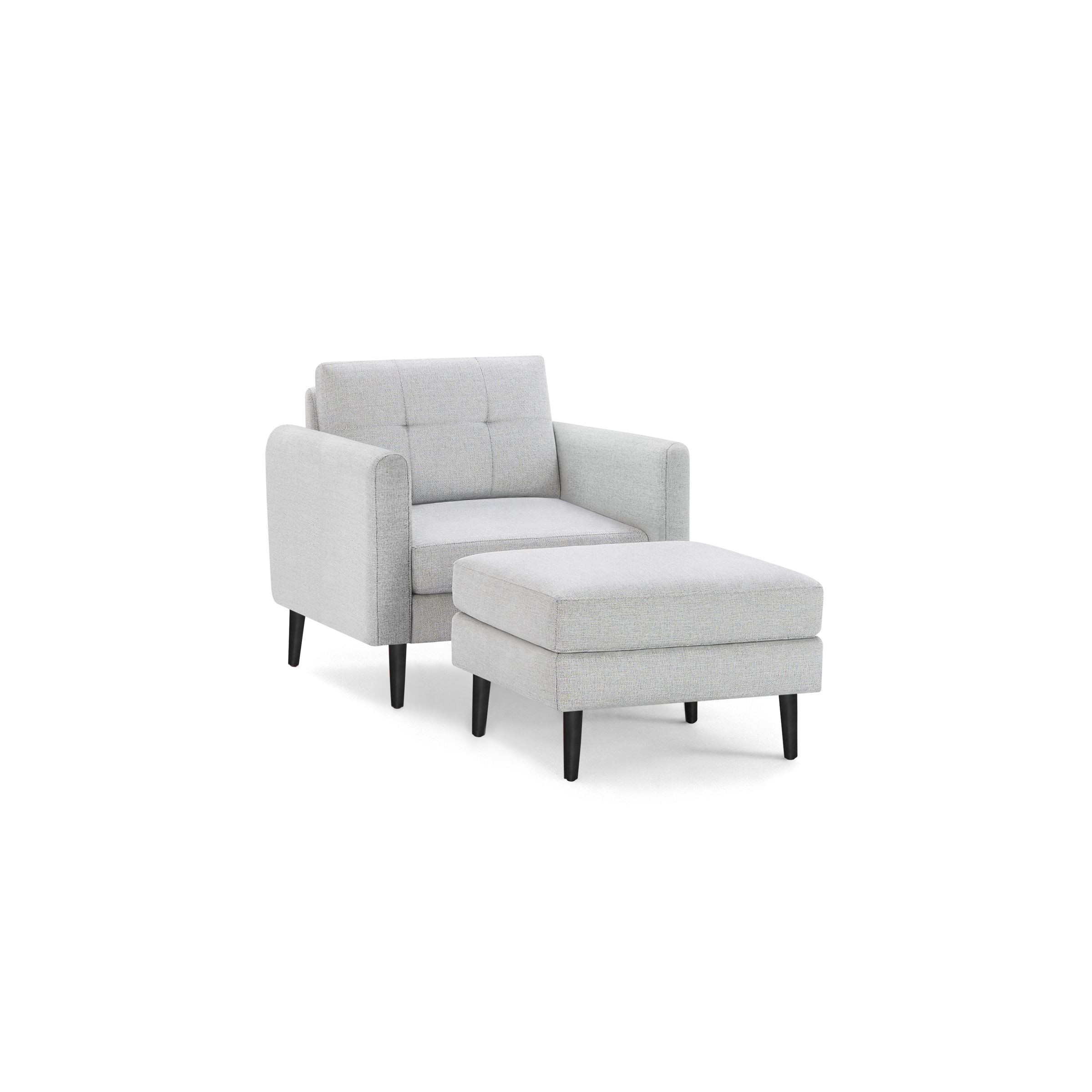 Light gray fabric armchair with tufted backrest and matching rectangular ottoman, both with black tapered legs.