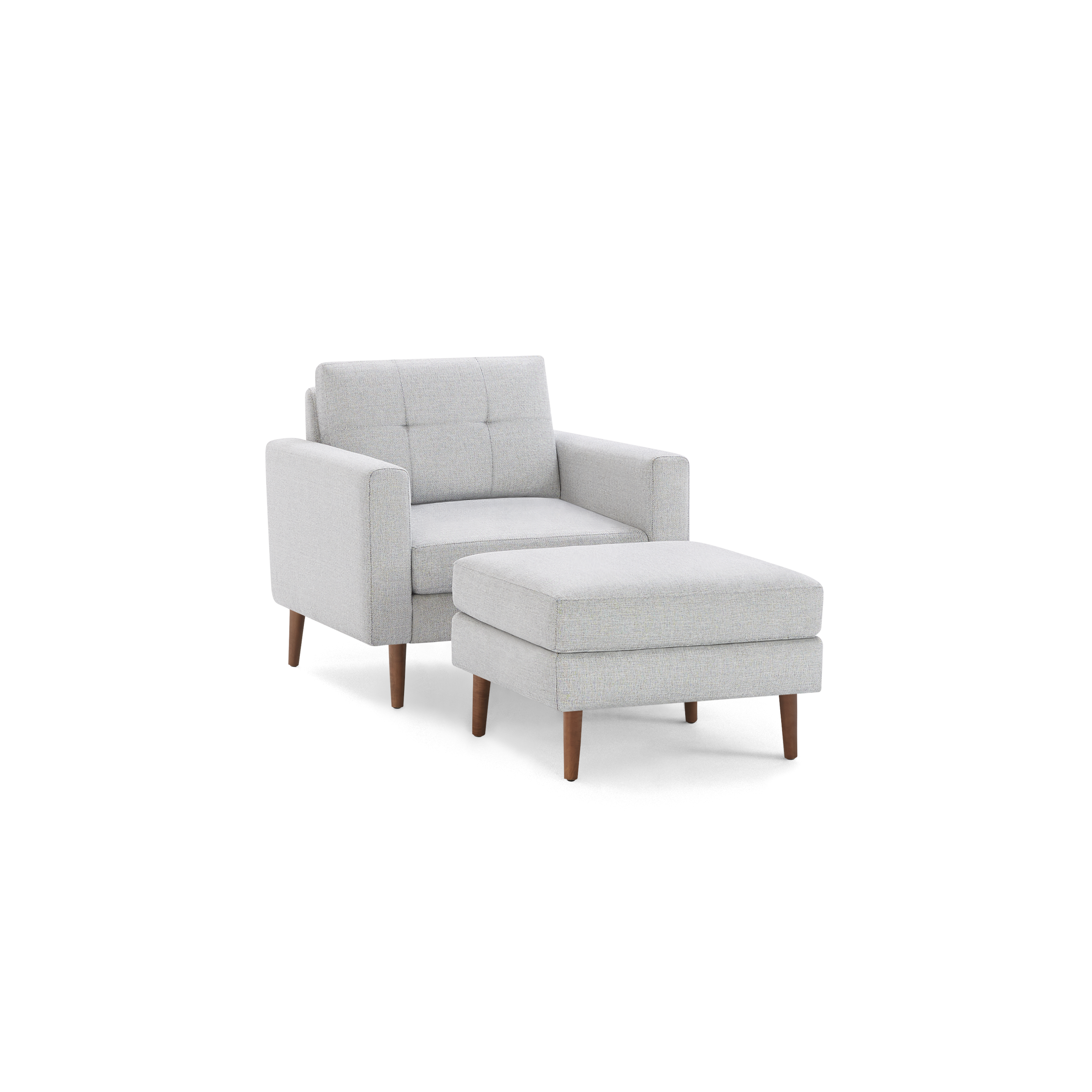 Light gray upholstered armchair with button-tufted backrest and matching ottoman, both featuring wooden legs.