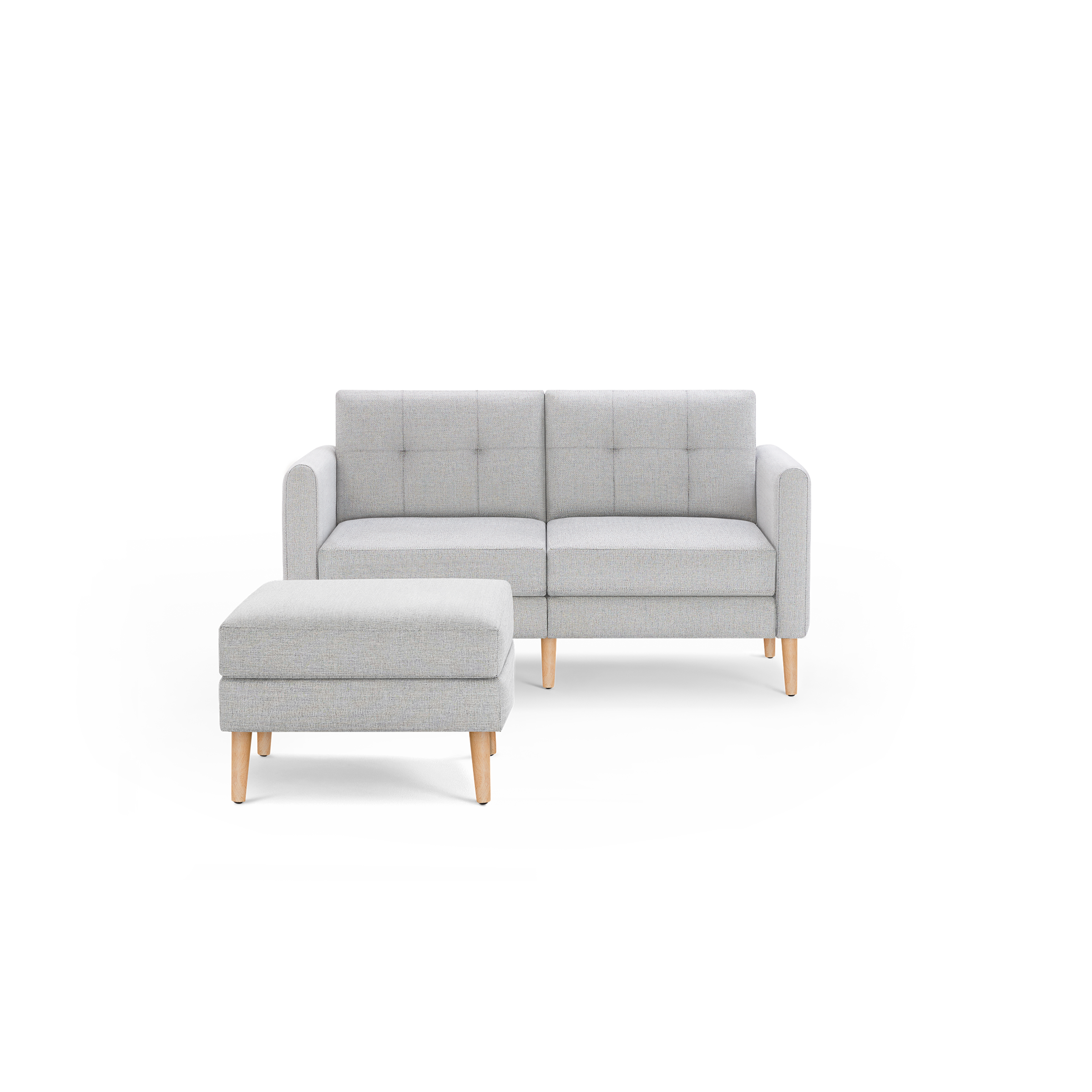 Light gray two-seater sofa with a matching ottoman, both featuring wooden legs and tufted cushion detailing.