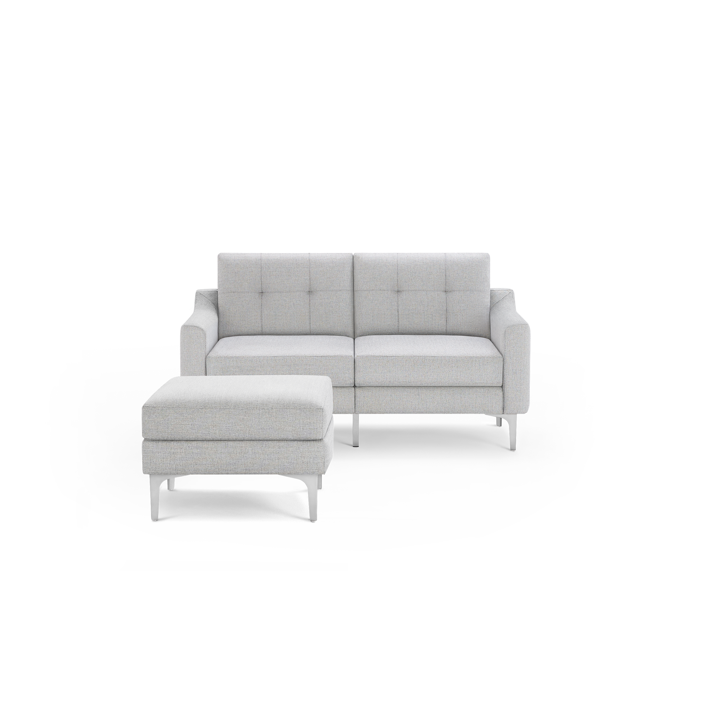 Light gray two-seater fabric sofa with tufted back cushions and matching cushioned ottoman, both supported by slim white legs.