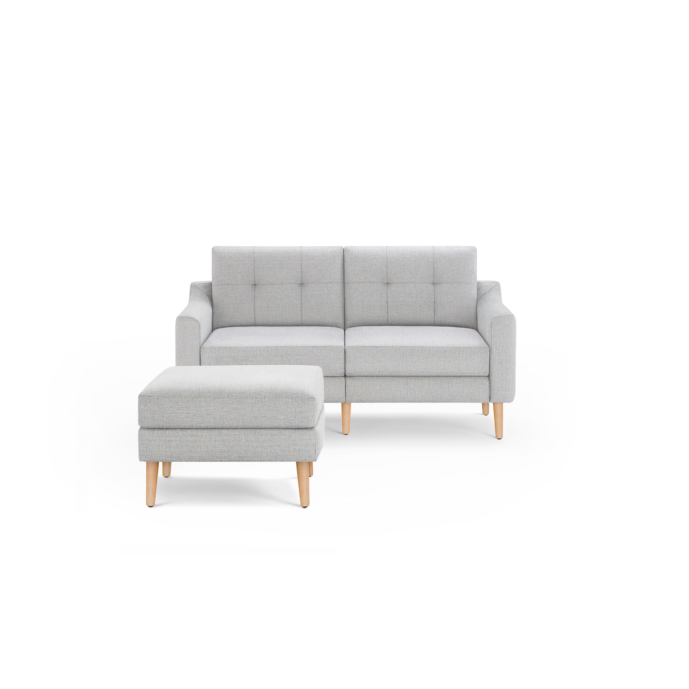 Light gray fabric loveseat sofa with wooden legs, tufted backrest, and matching ottoman against a black background.