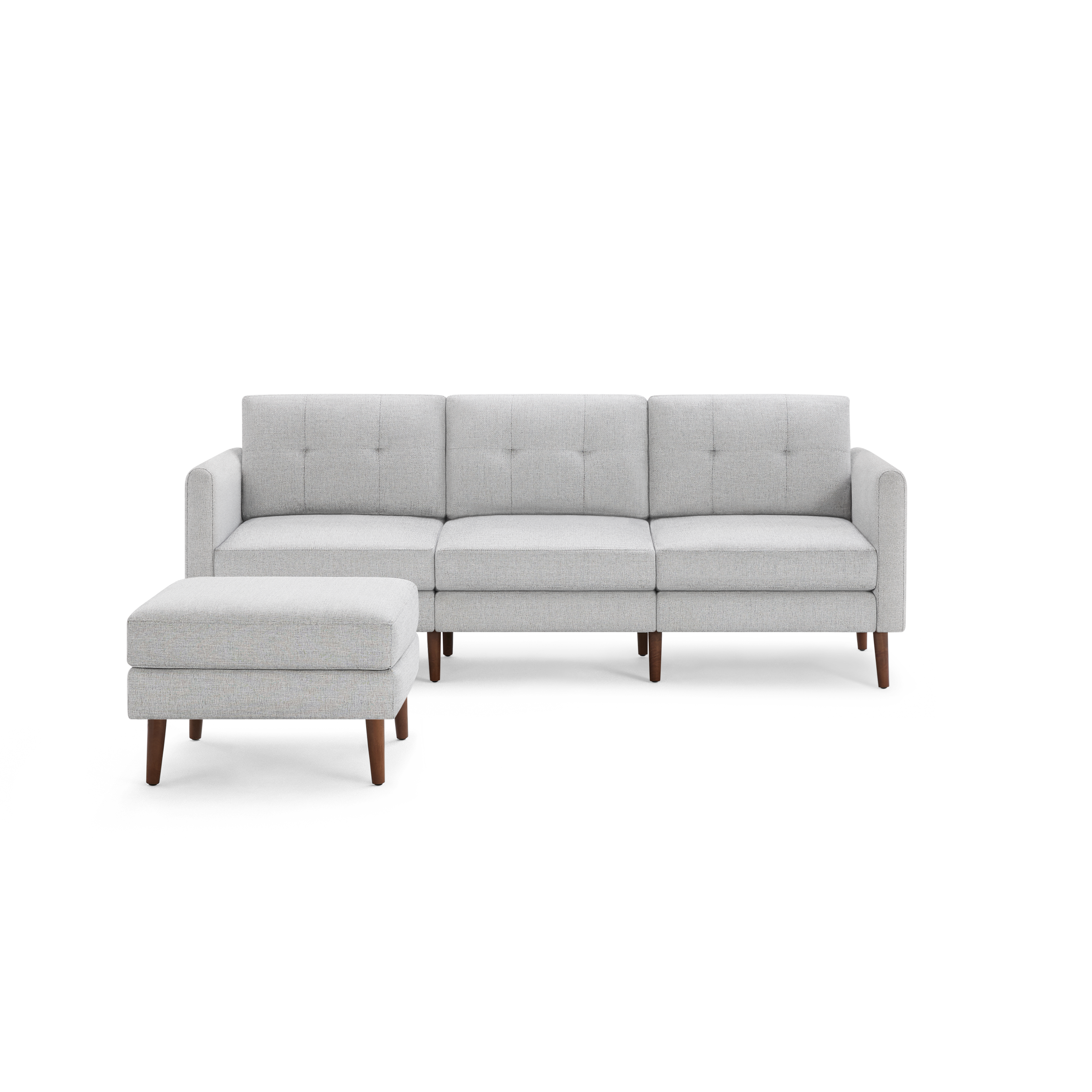 Light gray fabric mid-century modern sectional sofa with tufted back cushions and matching ottoman, supported by wooden legs.