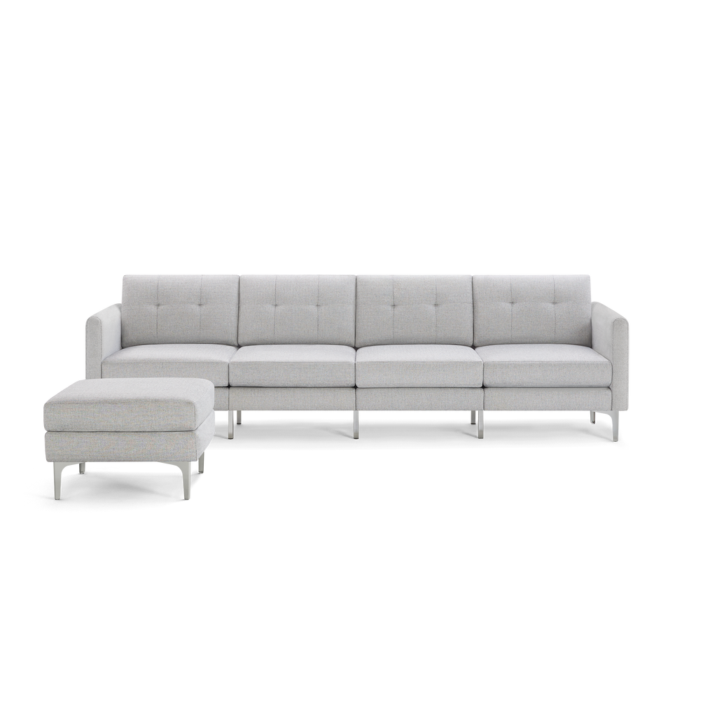 Light gray modern sectional sofa with metal legs and separate cushioned ottoman, tufted backrests, and clean lines.