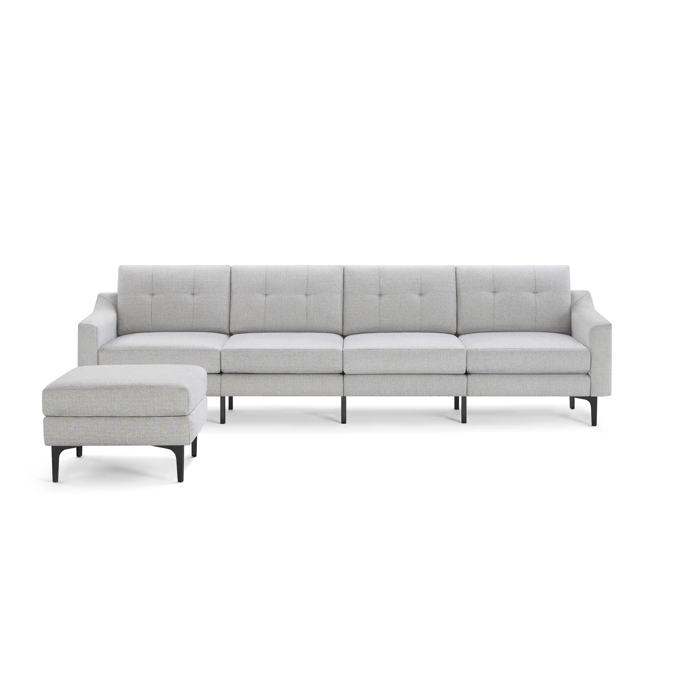 Light gray modern sectional sofa with button-tufted back cushions and matching ottoman, supported by slender black legs.