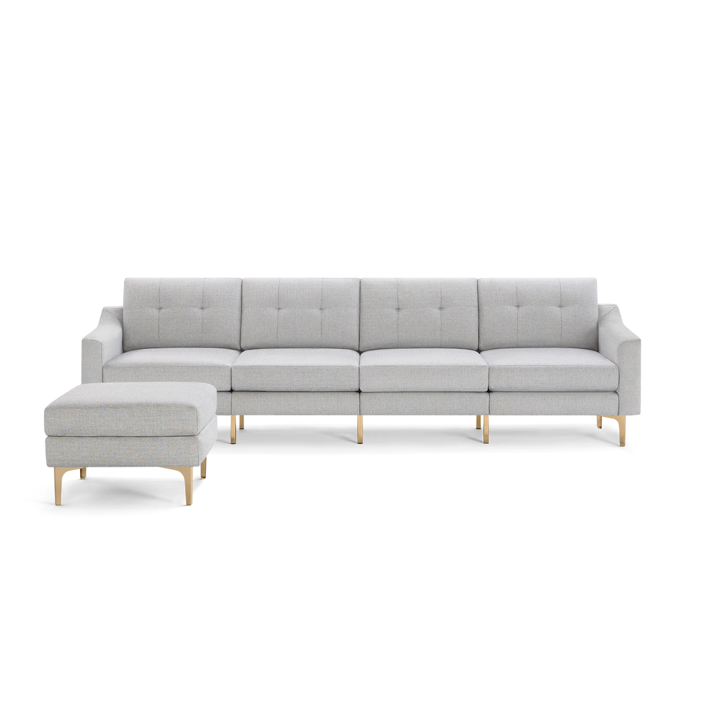 Light gray modern sectional sofa with tufted back cushions, straight armrests, and matching ottoman, supported by gold metal legs.
