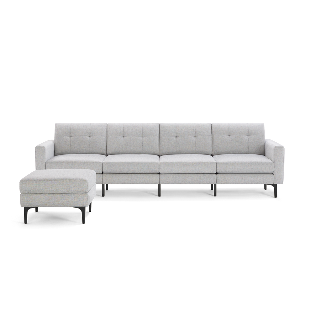 Light gray modern sectional sofa with tufted back cushions and separate matching ottoman, supported by black metal legs.