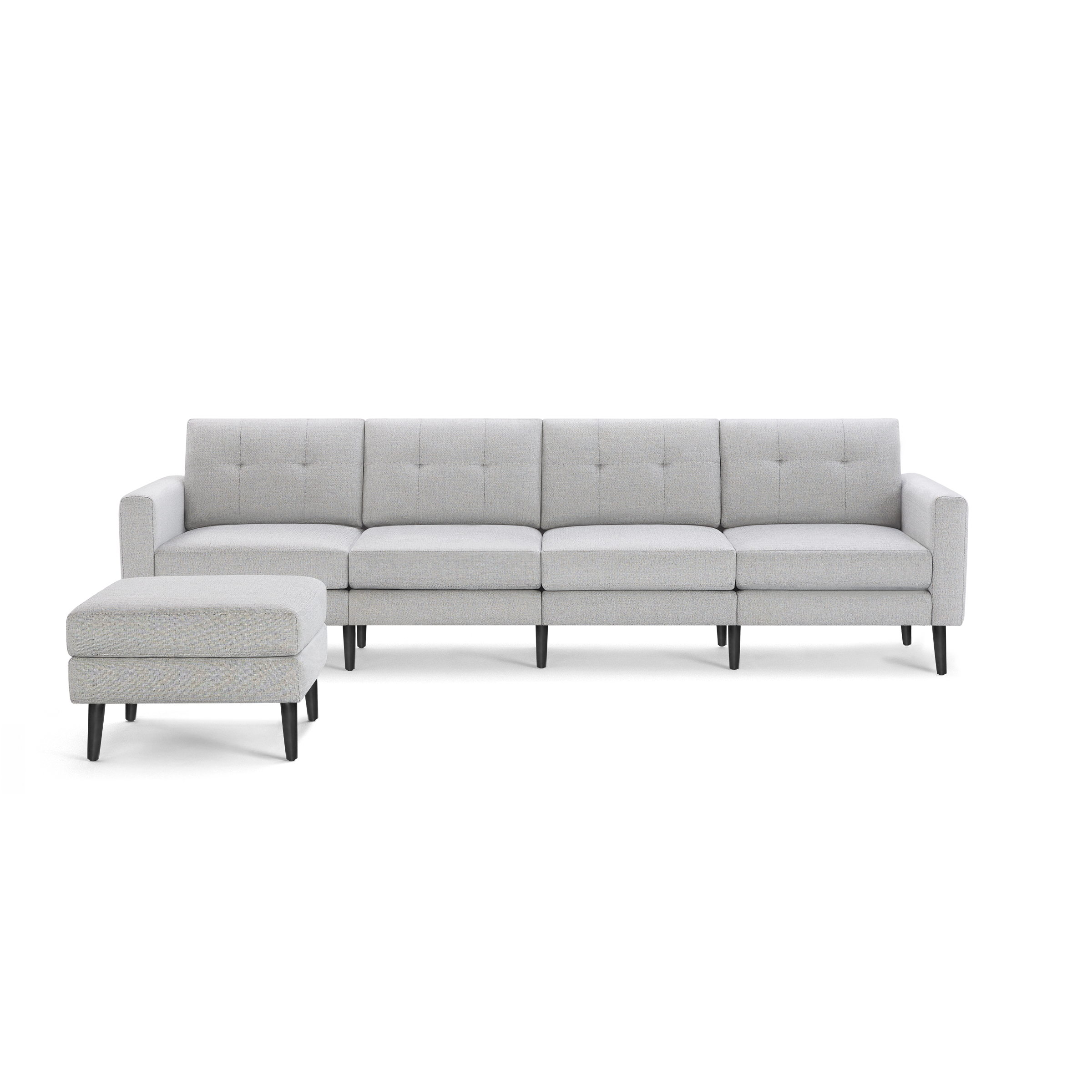 Light gray modern sectional sofa with tufted back cushions and matching ottoman, supported by black tapered legs.
