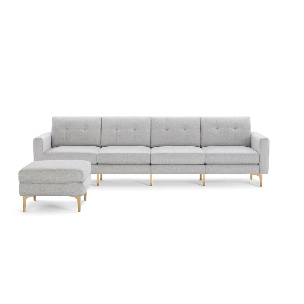 Light gray modern sectional sofa with clean lines, tufted cushions, matching ottoman, and gold metal legs.
