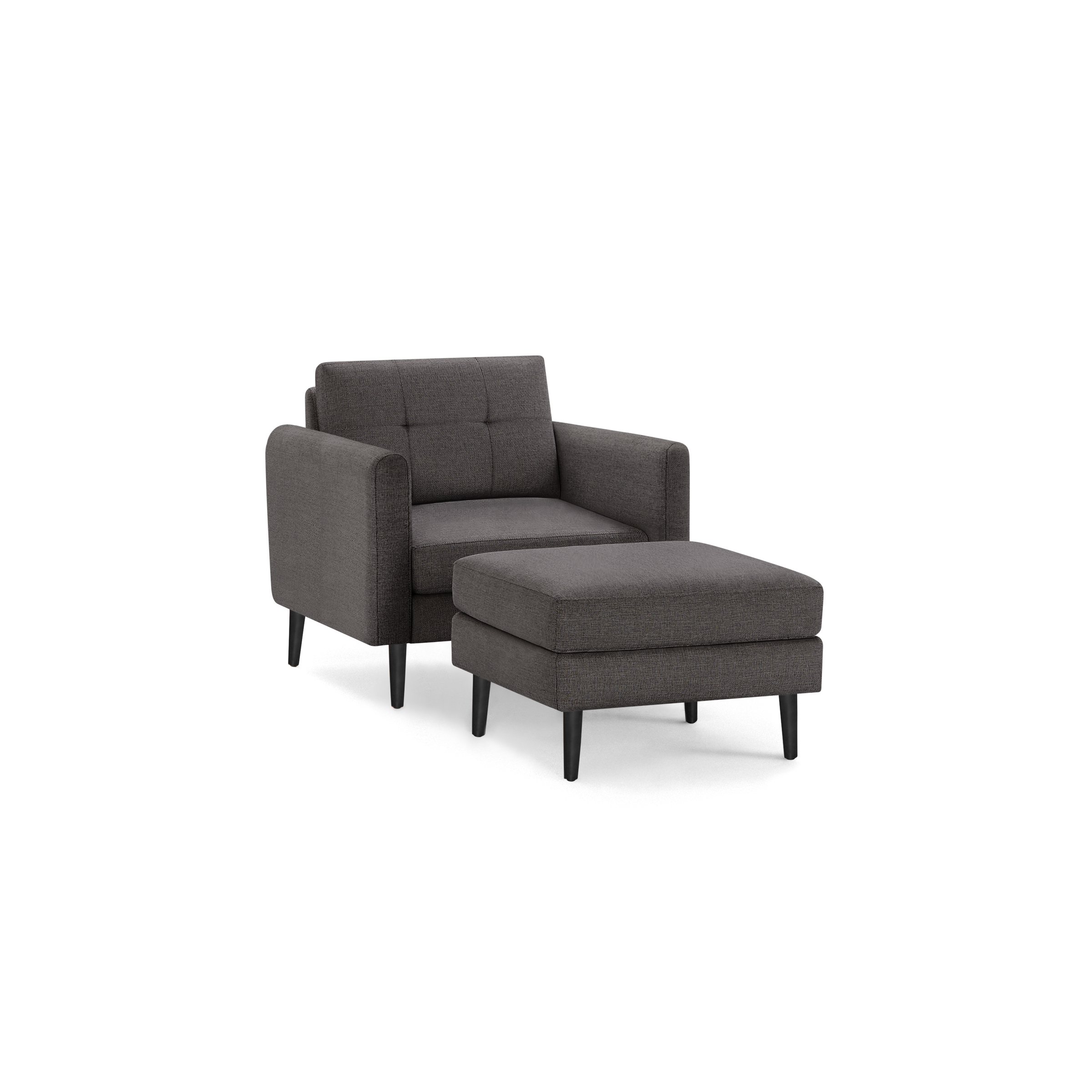 Dark gray upholstered armchair with button-tufted backrest and matching ottoman on black tapered legs.