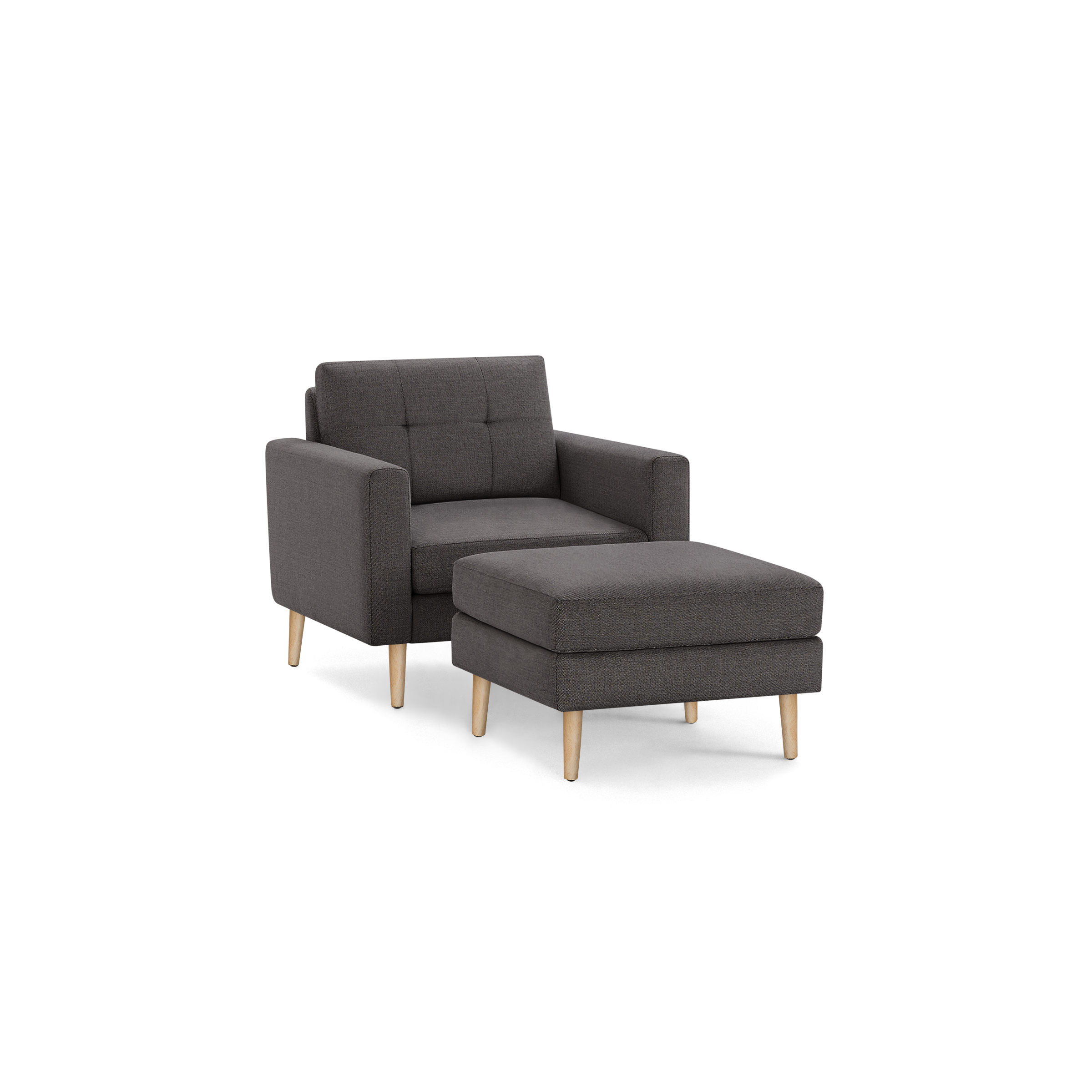 Modern dark gray fabric armchair with matching ottoman, both featuring wooden tapered legs and tufted backrest.