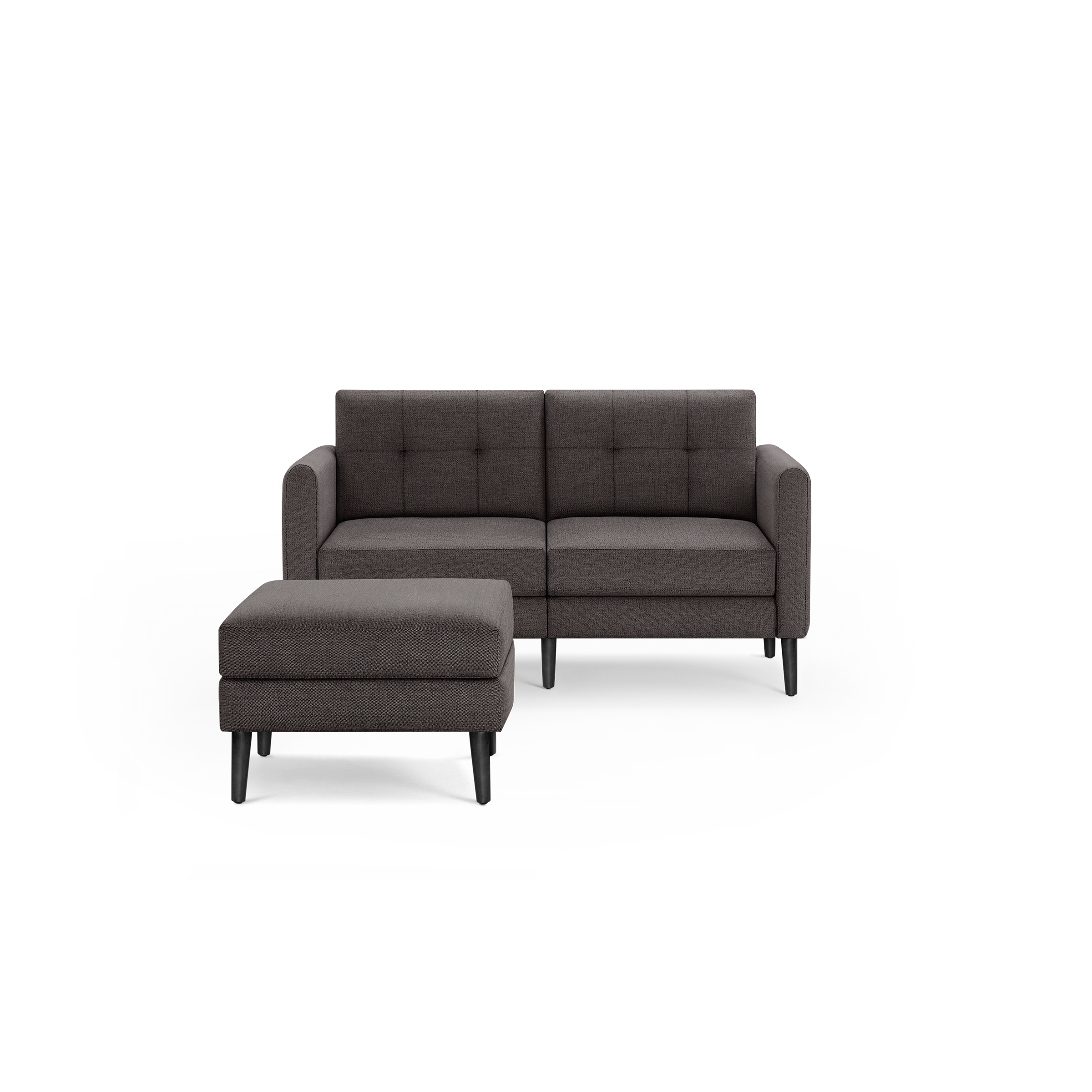 Modern dark gray fabric loveseat with tufted back cushions and matching ottoman, supported by black wooden legs.
