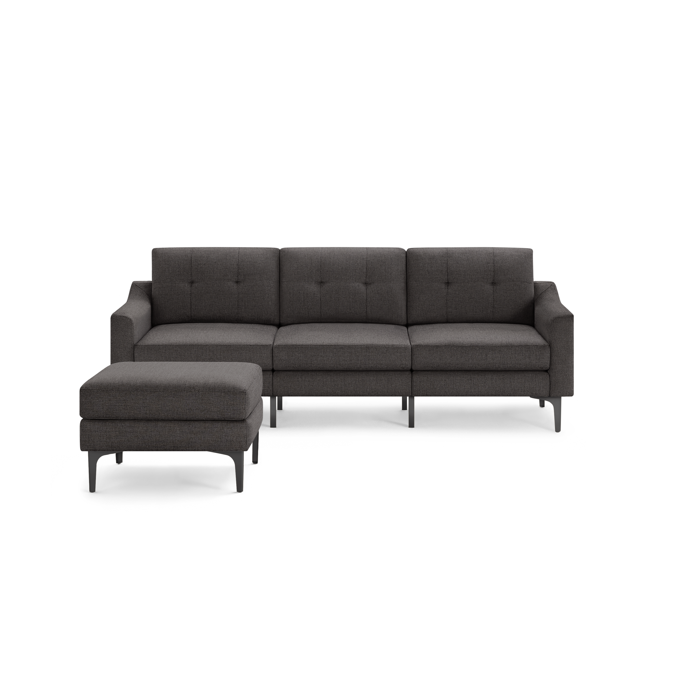 Dark gray modern three-seater sofa with tufted back cushions and a matching ottoman, featuring sleek metal legs.